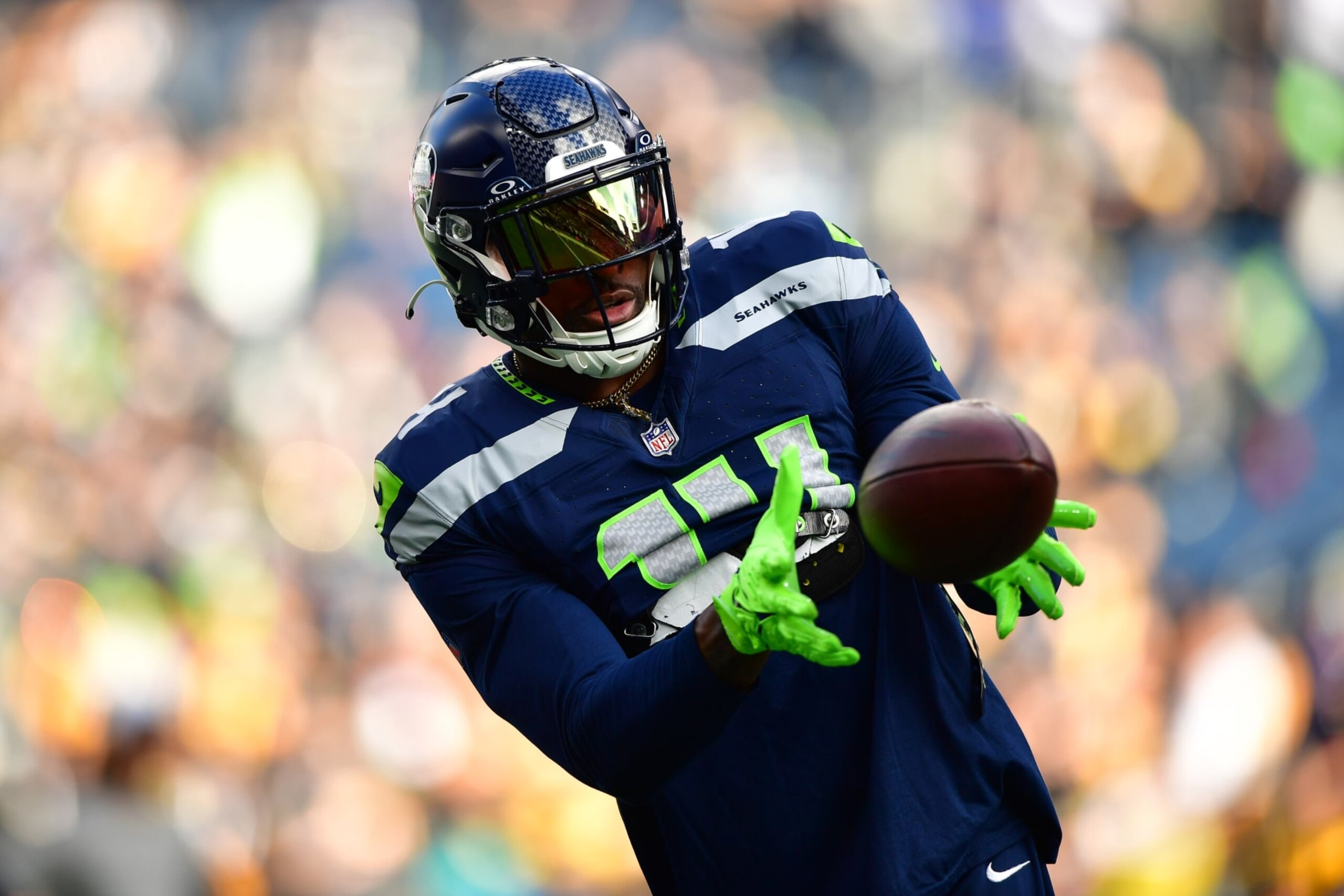 SEATTLE, WASHINGTON - DECEMBER 31: DK Metcalf #14 of the Seattle Seahawks warms up prior to a game against the Pittsburgh Steelers at Lumen Field on December 31, 2023 in Seattle, Washington. (Photo by Jane Gershovich/Getty Images)