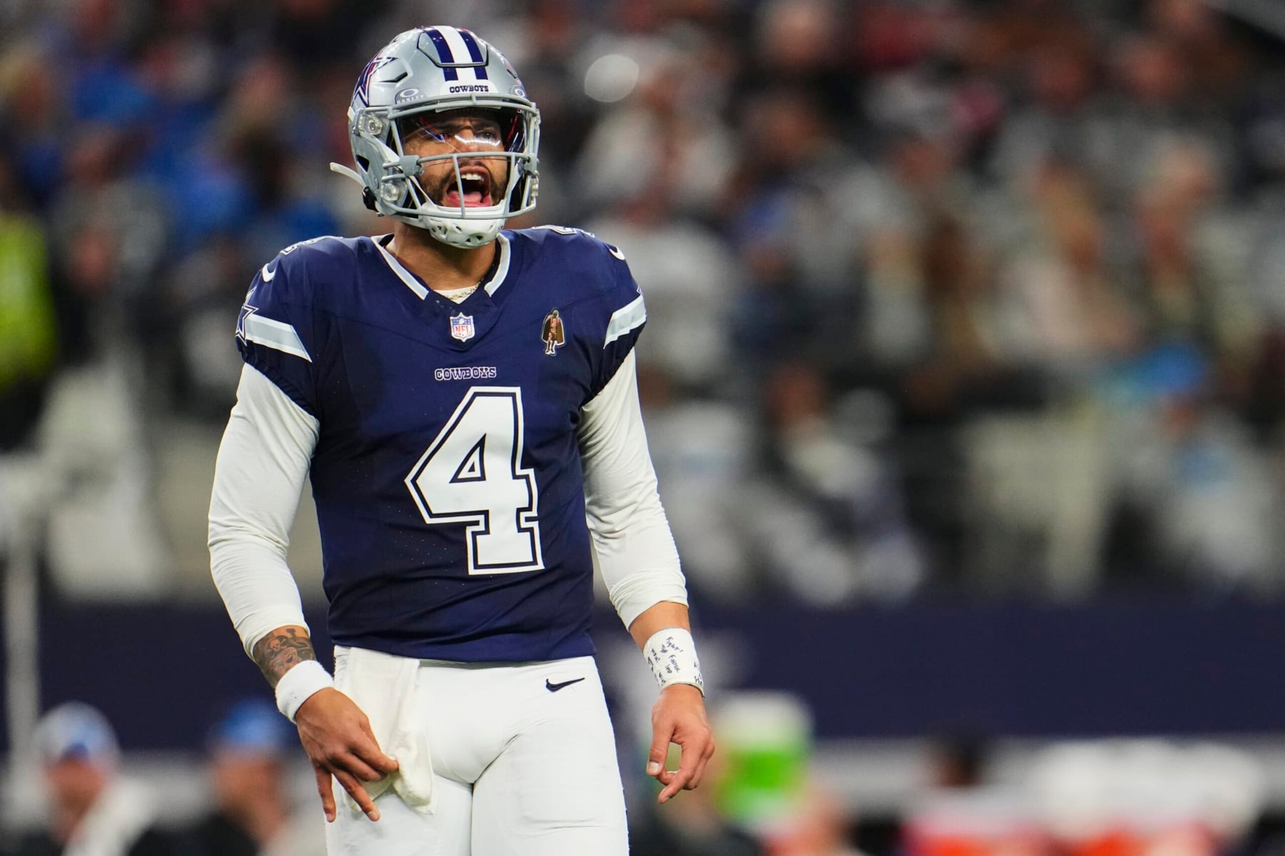 ARLINGTON, TX - DECEMBER 30: Dak Prescott #4 of the Dallas Cowboys reacts after a play against the Detroit Lions during the second half at AT&T Stadium on December 30, 2023 in Arlington, Texas. (Photo by Cooper Neill/Getty Images)