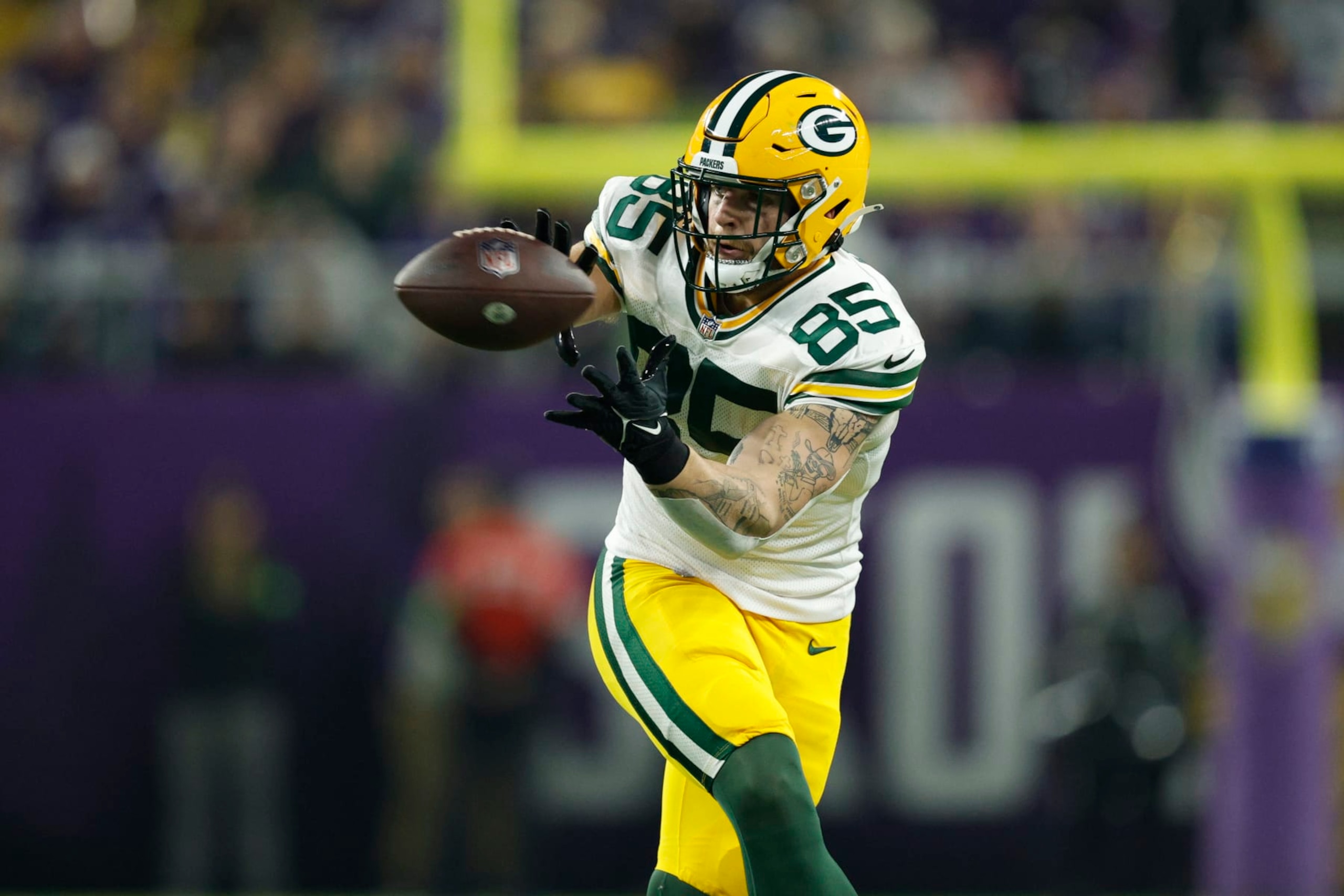 MINNEAPOLIS, MINNESOTA - DECEMBER 31: Tucker Kraft #85 of the Green Bay Packers catches a pass during the first quarter against the Minnesota Vikings at U.S. Bank Stadium on December 31, 2023 in Minneapolis, Minnesota. (Photo by David Berding/Getty Images)