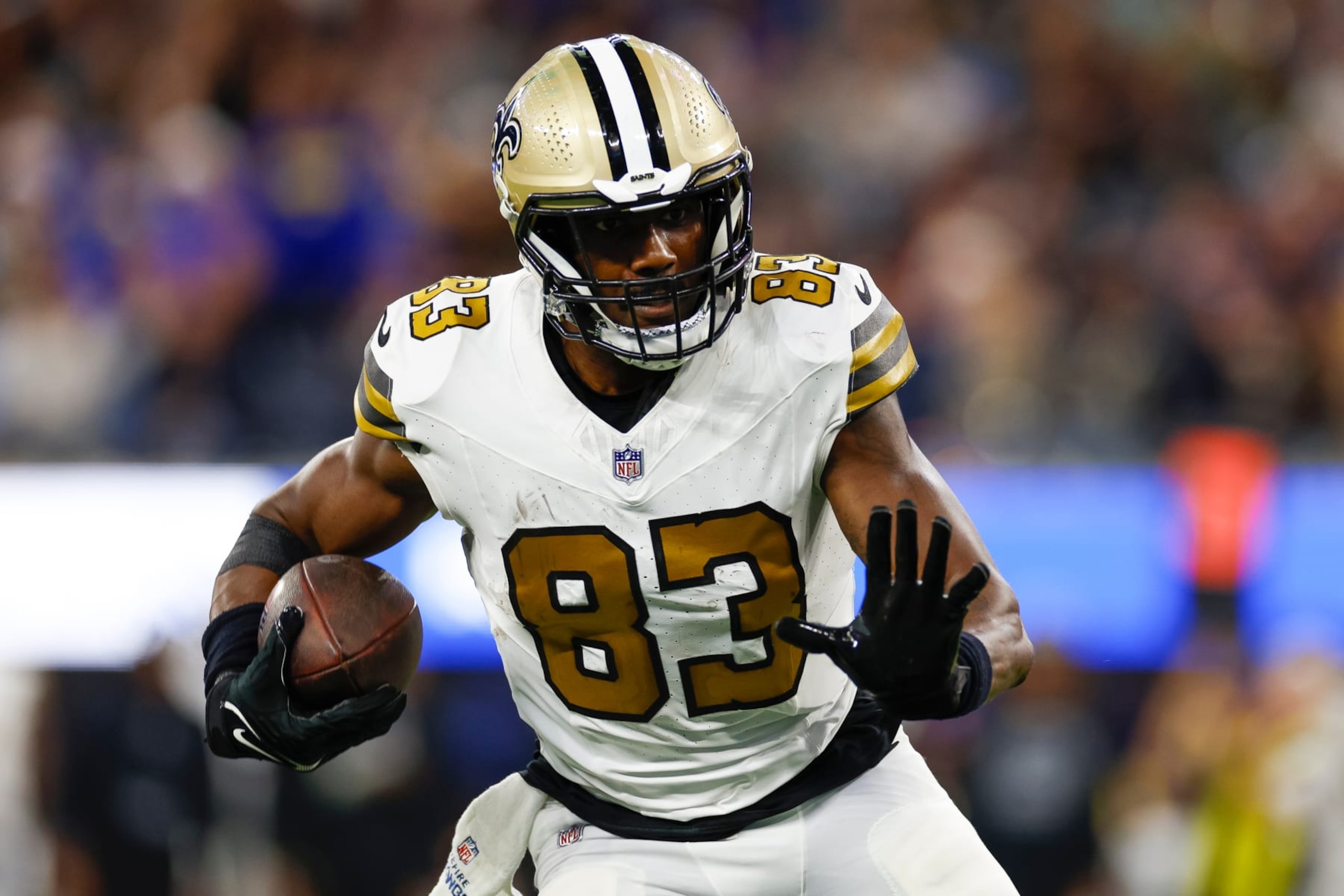 INGLEWOOD, CA - DECEMBER 21: New Orleans Saints tight end Juwan Johnson (83) runs with the ball in the second half during an NFL regular season game between the New Orleans Saints and the Los Angeles Rams on December 21, 2023, at SoFi Stadium in Inglewood, CA. (Photo by Brandon Sloter/Icon Sportswire via Getty Images)