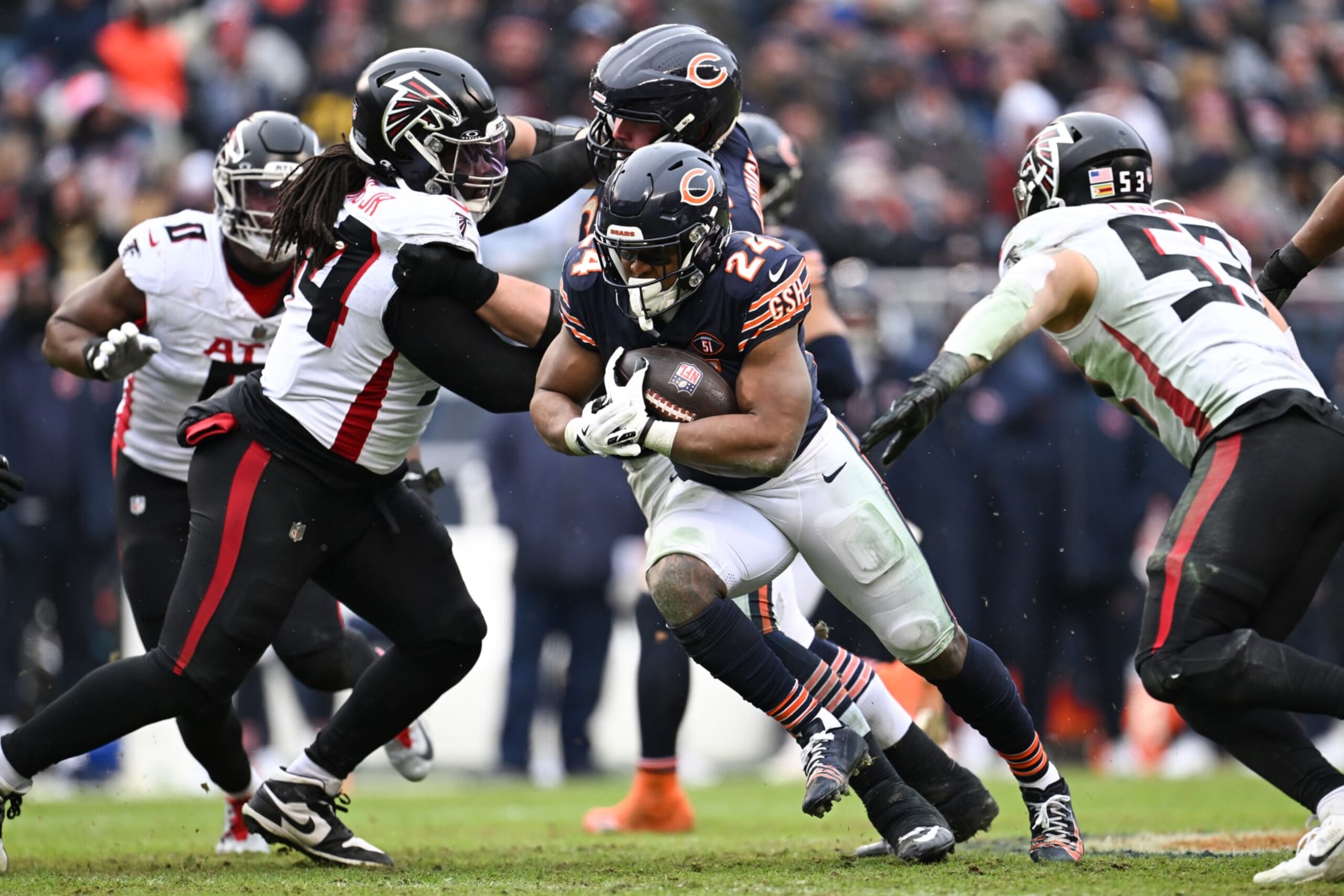 CHICAGO, ILLINOIS - DECEMBER 31: Khalil Herbert #24 of the Chicago Bears runs the ball during the third quarter against the Atlanta Falcons at Soldier Field on December 31, 2023 in Chicago, Illinois. (Photo by Quinn Harris/Getty Images)