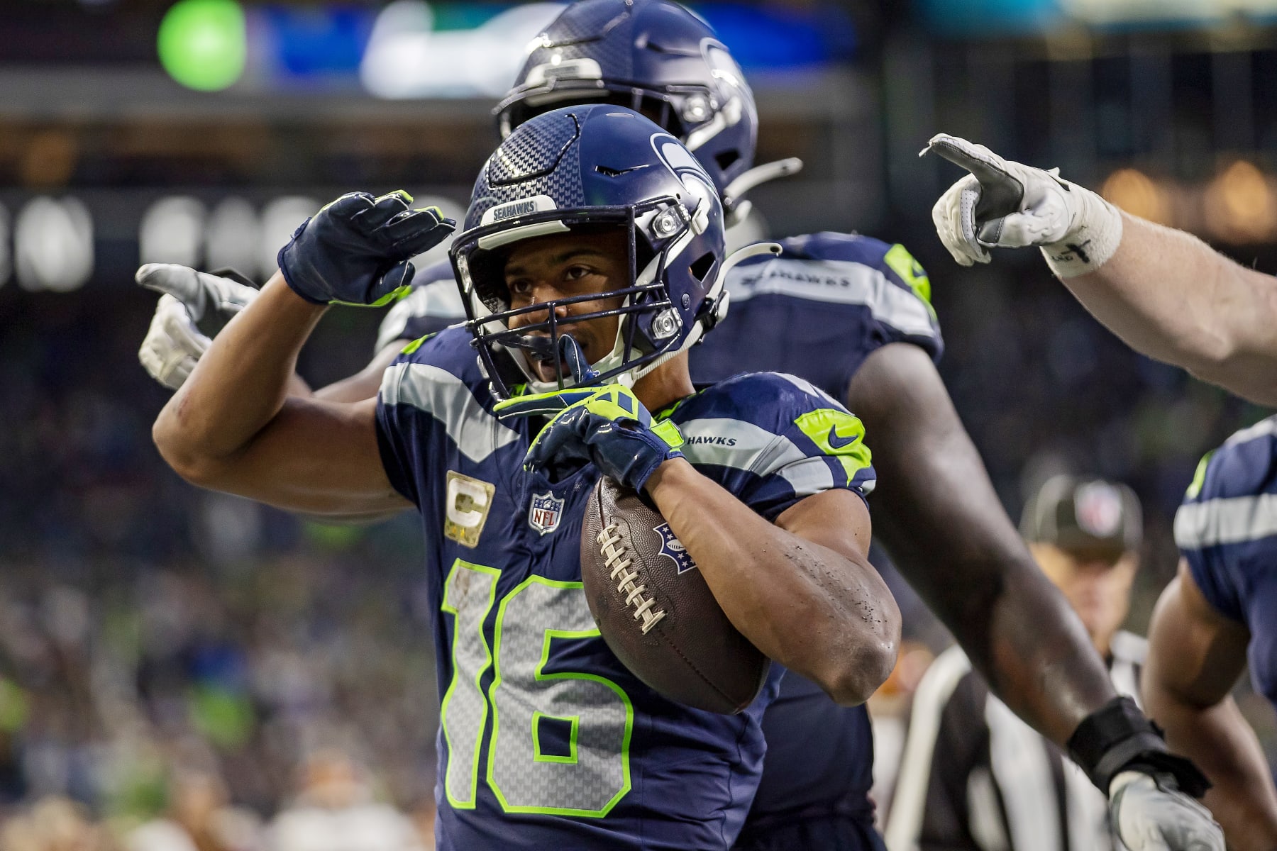SEATTLE, WASHINGTON - NOVEMBER 12: Tyler Lockett #16 of the Seattle Seahawks celebrates after scoring a receiving touchdown during the fourth quarter against the Washington Commanders at Lumen Field on November 12, 2023 in Seattle, Washington. (Photo by Tom Hauck/Getty Images)