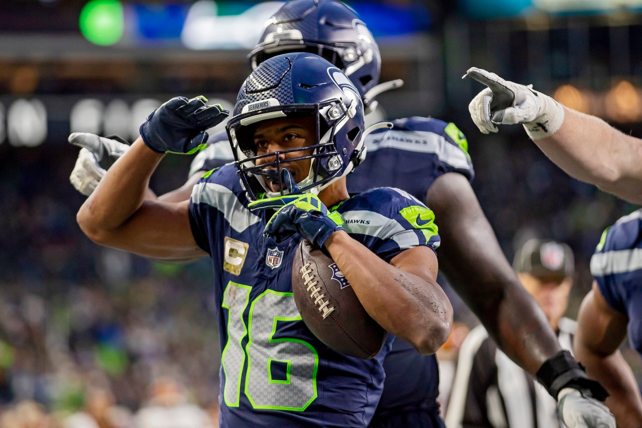SEATTLE, WASHINGTON - NOVEMBER 12: Tyler Lockett #16 of the Seattle Seahawks celebrates after scoring a receiving touchdown during the fourth quarter against the Washington Commanders at Lumen Field on November 12, 2023 in Seattle, Washington. (Photo by Tom Hauck/Getty Images)