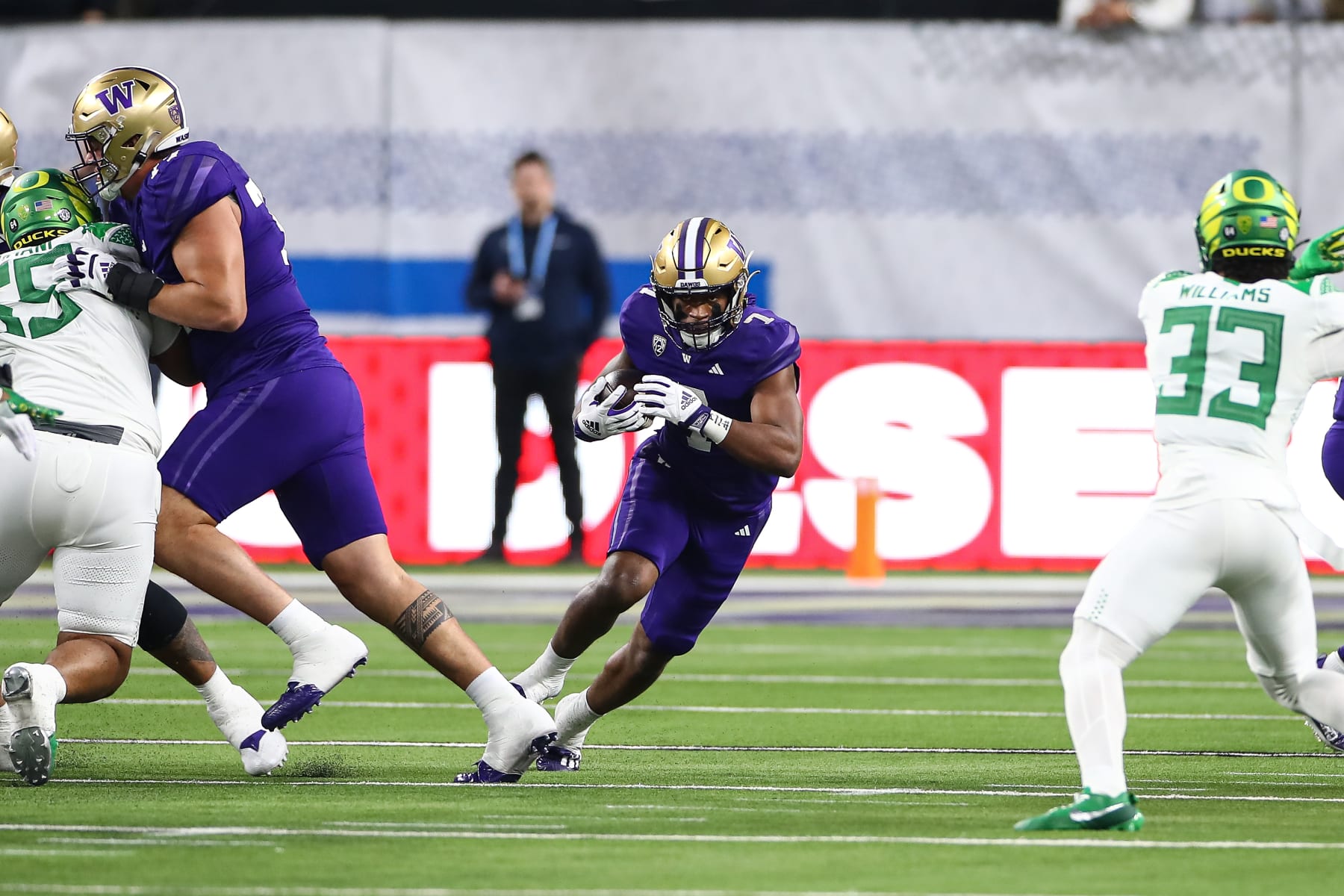 LAS VEGAS, NV - LAS VEGAS, NV - DECEMBER 01:   Washington Huskies running back Dillon Johnson (7) runs through a hole during the PAC-12 Football Championship Game between the Oregon Ducks and the Washington Huskies on December 01, 2023, at Allegiant Stadium in  Las Vegas, NV. (Photo by Jevone Moore/Icon Sportswire via Getty Images)
