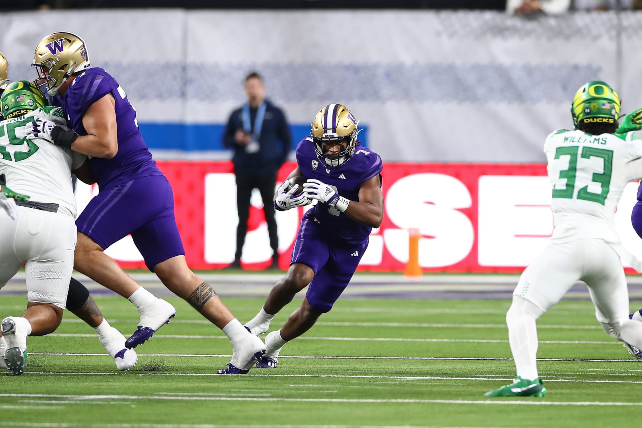LAS VEGAS, NV - LAS VEGAS, NV - DECEMBER 01: Washington Huskies running back Dillon Johnson (7) runs through a hole during the PAC-12 Football Championship Game between the Oregon Ducks and the Washington Huskies on December 01, 2023, at Allegiant Stadium in Las Vegas, NV. (Photo by Jevone Moore/Icon Sportswire via Getty Images) LAS VEGAS, NV - LAS VEGAS, NV - DECEMBER 01: Washington Huskies running back Dillon Johnson (7) runs through a hole during the PAC-12 Football Championship Game between the Oregon Ducks and the Washington Huskies on December 01, 2023, at Allegiant Stadium in Las Vegas, NV. (Photo by Jevone Moore/Icon Sportswire via Getty Images)