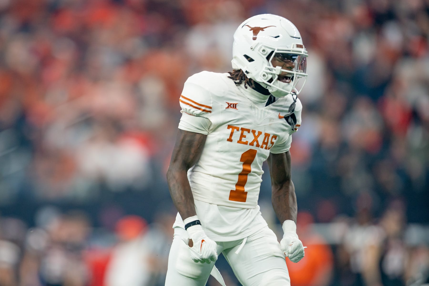 ARLINGTON, TX - DECEMBER 02:Texas Longhorns wide receiver Xavier Worthy (1) celebrates a big play during the Big 12 Championship game between the Texas Longhorns and the Oklahoma State Cowboys   on December 02, 2023 at AT&T Stadium in Arlington, TX. (Photo by Chris Leduc/Icon Sportswire via Getty Images)