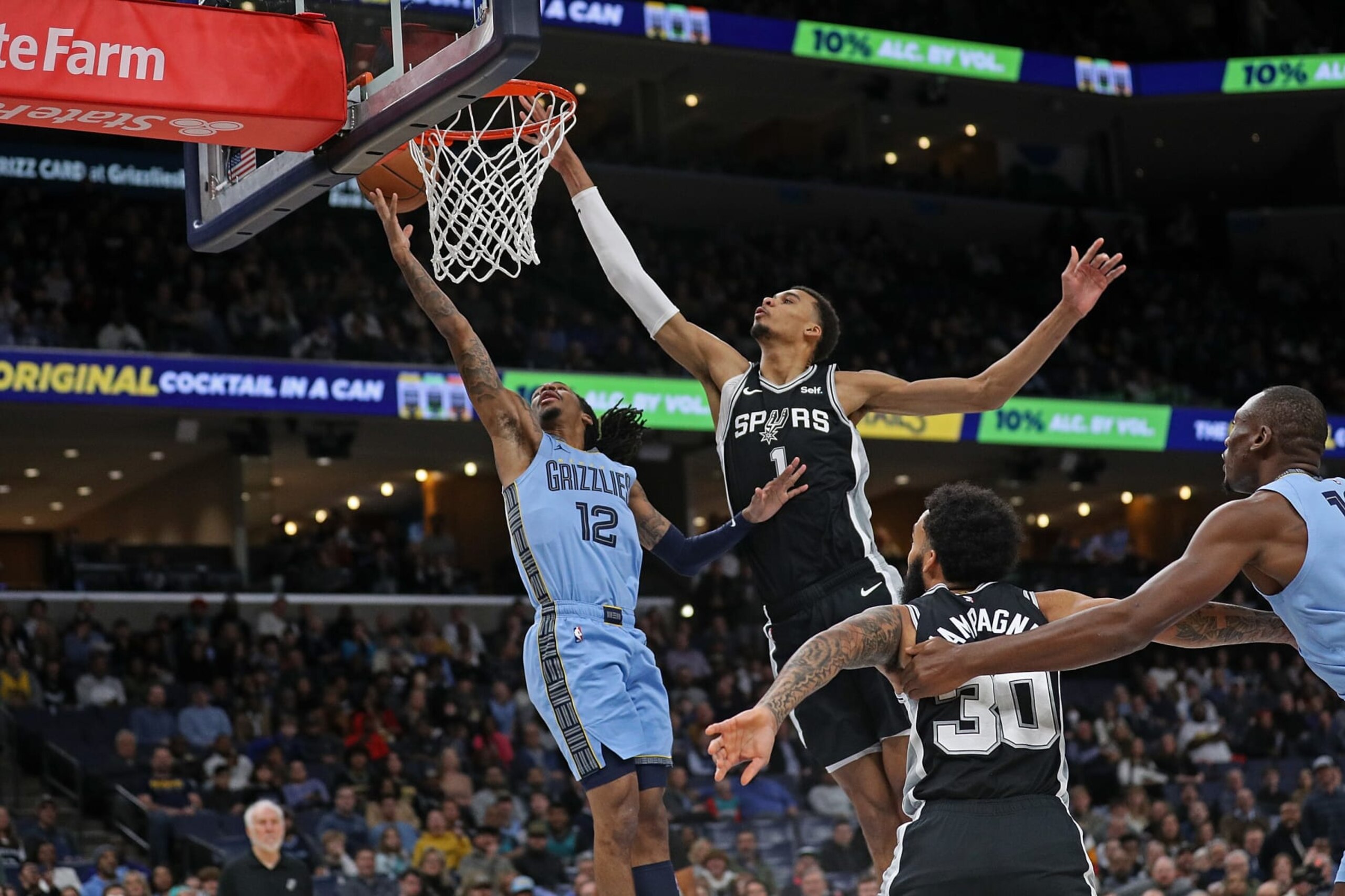 MEMPHIS, TENNESSEE - JANUARY 02: Ja Morant #12 of the Memphis Grizzlies goes to the basket against Victor Wembanyama #1 of the San Antonio Spurs during the first half at FedExForum on January 02, 2024 in Memphis, Tennessee. NOTE TO USER: User expressly acknowledges and agrees that, by downloading and or using this photograph, User is consenting to the terms and conditions of the Getty Images License Agreement. (Photo by Justin Ford/Getty Images) MEMPHIS, TENNESSEE - JANUARY 02: Ja Morant #12 of the Memphis Grizzlies goes to the basket against Victor Wembanyama #1 of the San Antonio Spurs during the first half at FedExForum on January 02, 2024 in Memphis, Tennessee. NOTE TO USER: User expressly acknowledges and agrees that, by downloading and or using this photograph, User is consenting to the terms and conditions of the Getty Images License Agreement. (Photo by Justin Ford/Getty Images)