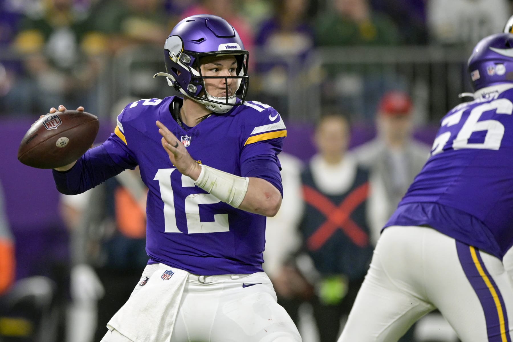 MINNEAPOLIS, MN - DECEMBER 31: Minnesota Vikings quarterback Nick Mullens (12) makes a pass during the fourth quarter of an NFL game between the Minnesota Vikings and Green Bay Packers on December 31, 2023, at U.S. Bank Stadium in Minneapolis, MN. (Photo by Nick Wosika/Icon Sportswire via Getty Images)