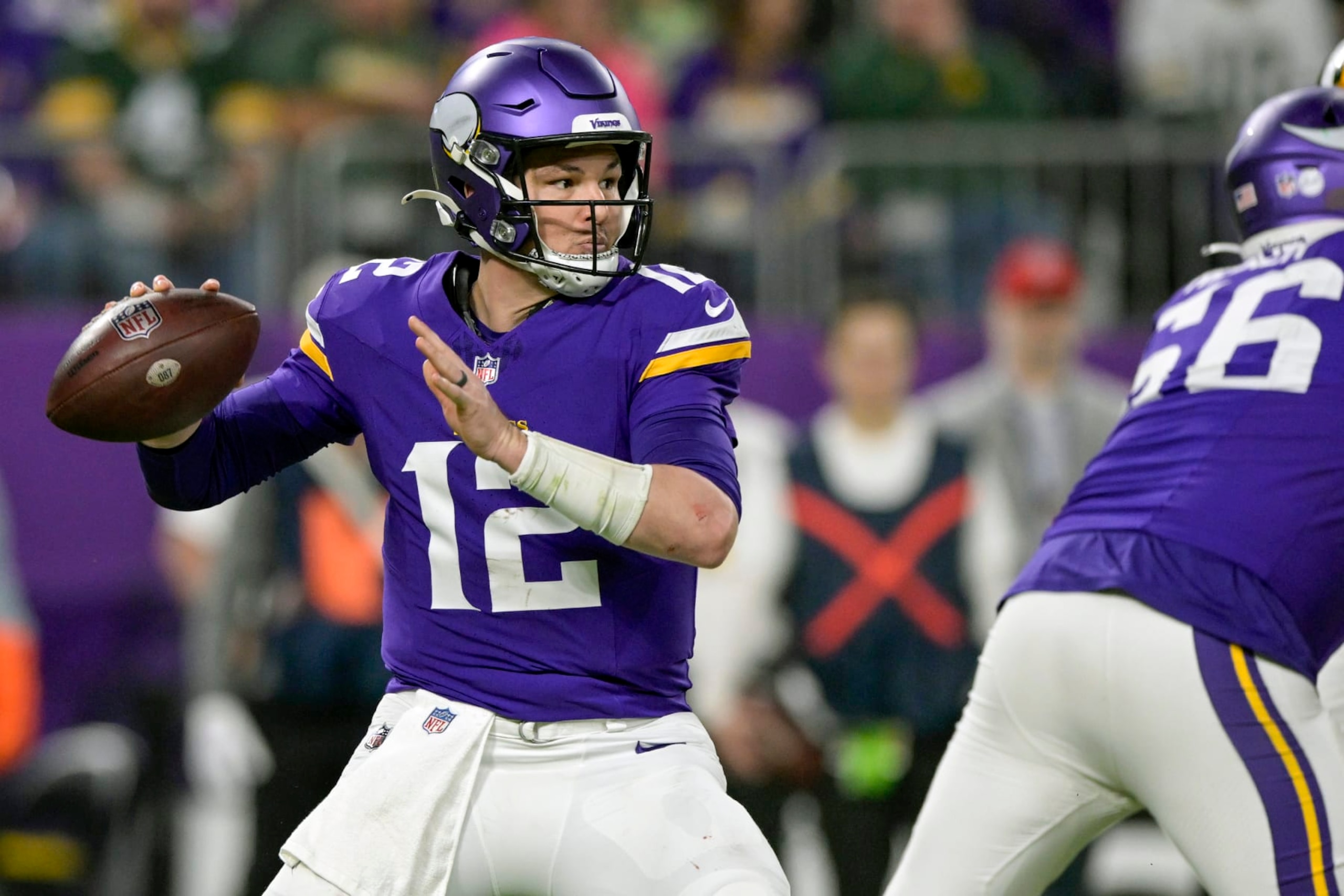 MINNEAPOLIS, MN - DECEMBER 31: Minnesota Vikings quarterback Nick Mullens (12) makes a pass during the fourth quarter of an NFL game between the Minnesota Vikings and Green Bay Packers on December 31, 2023, at U.S. Bank Stadium in Minneapolis, MN. (Photo by Nick Wosika/Icon Sportswire via Getty Images)