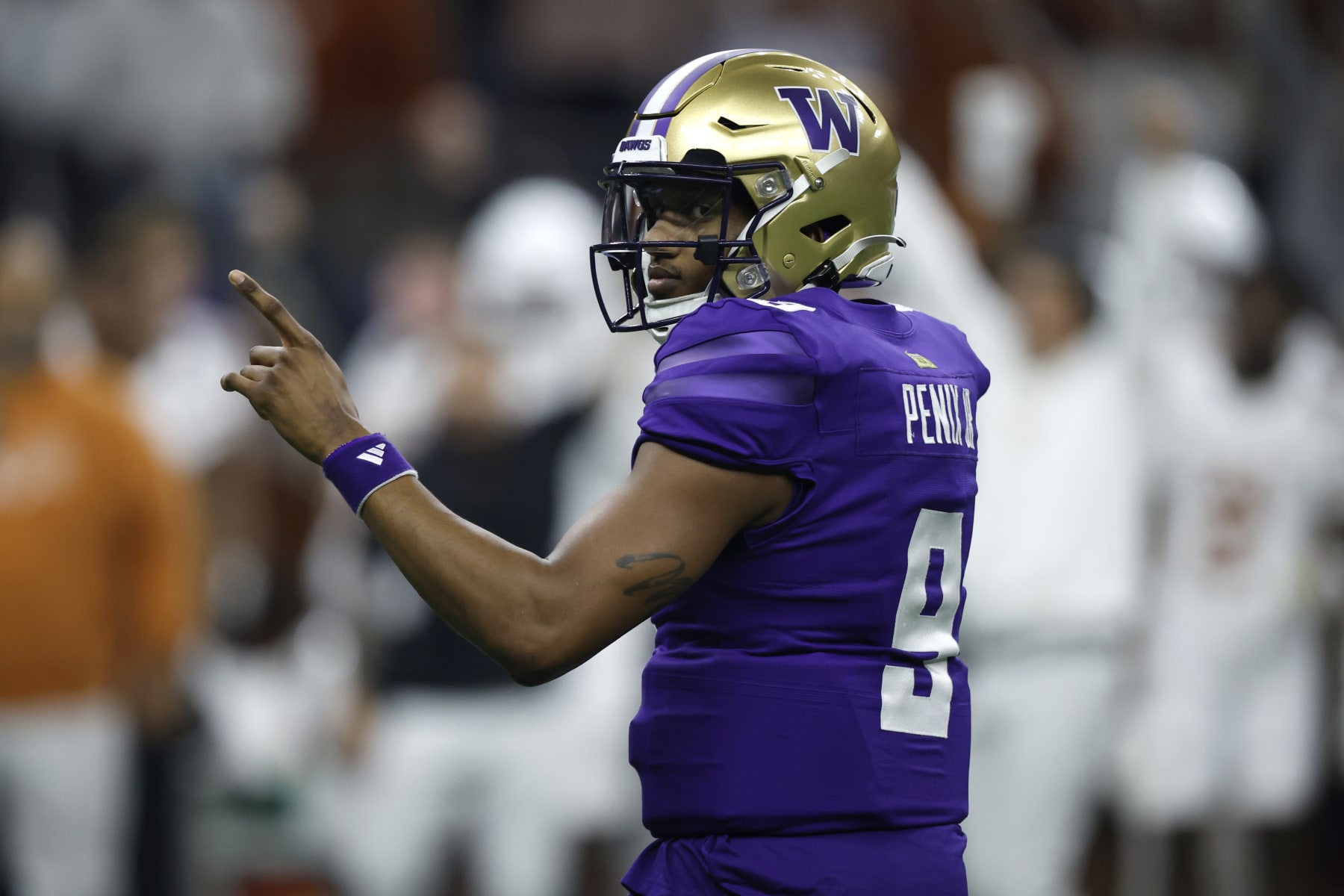 NEW ORLEANS, LOUISIANA - JANUARY 01: Michael Penix Jr. #9 of the Washington Huskies reacts during the second quarter against the Texas Longhorns during the CFP Semifinal Allstate Sugar Bowl at Caesars Superdome on January 01, 2024 in New Orleans, Louisiana. (Photo by Chris Graythen/Getty Images)