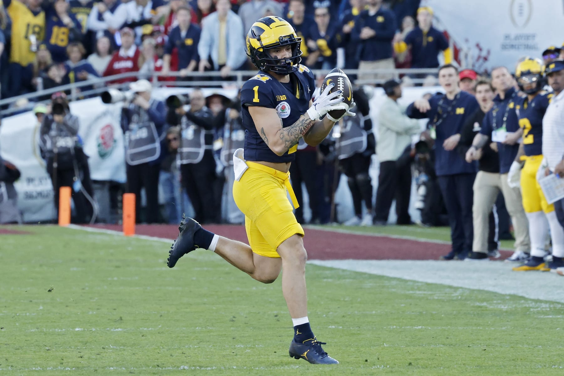PASADENA, CALIFORNIA - JANUARY 01: Roman Wilson #1 of the Michigan Wolverines runs with the ball in the second quarter against the Alabama Crimson Tide during the CFP Semifinal Rose Bowl Game at Rose Bowl Stadium on January 01, 2024 in Pasadena, California. (Photo by Kevork Djansezian/Getty Images)