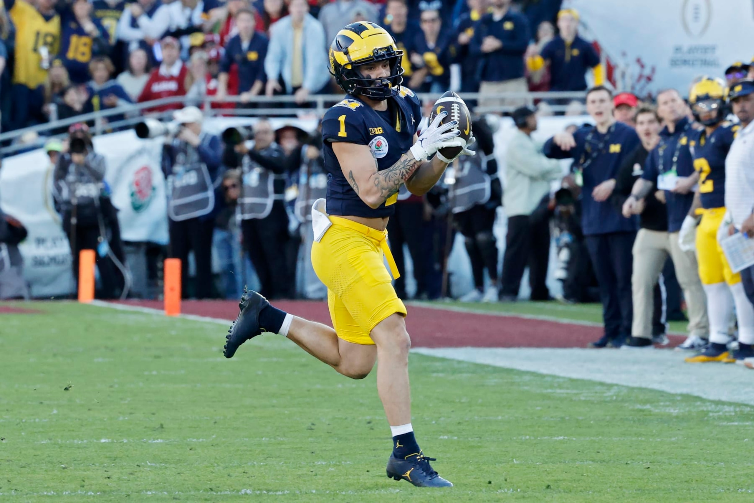 PASADENA, CALIFORNIA - JANUARY 01: Roman Wilson #1 of the Michigan Wolverines runs with the ball in the second quarter against the Alabama Crimson Tide during the CFP Semifinal Rose Bowl Game at Rose Bowl Stadium on January 01, 2024 in Pasadena, California. (Photo by Kevork Djansezian/Getty Images)