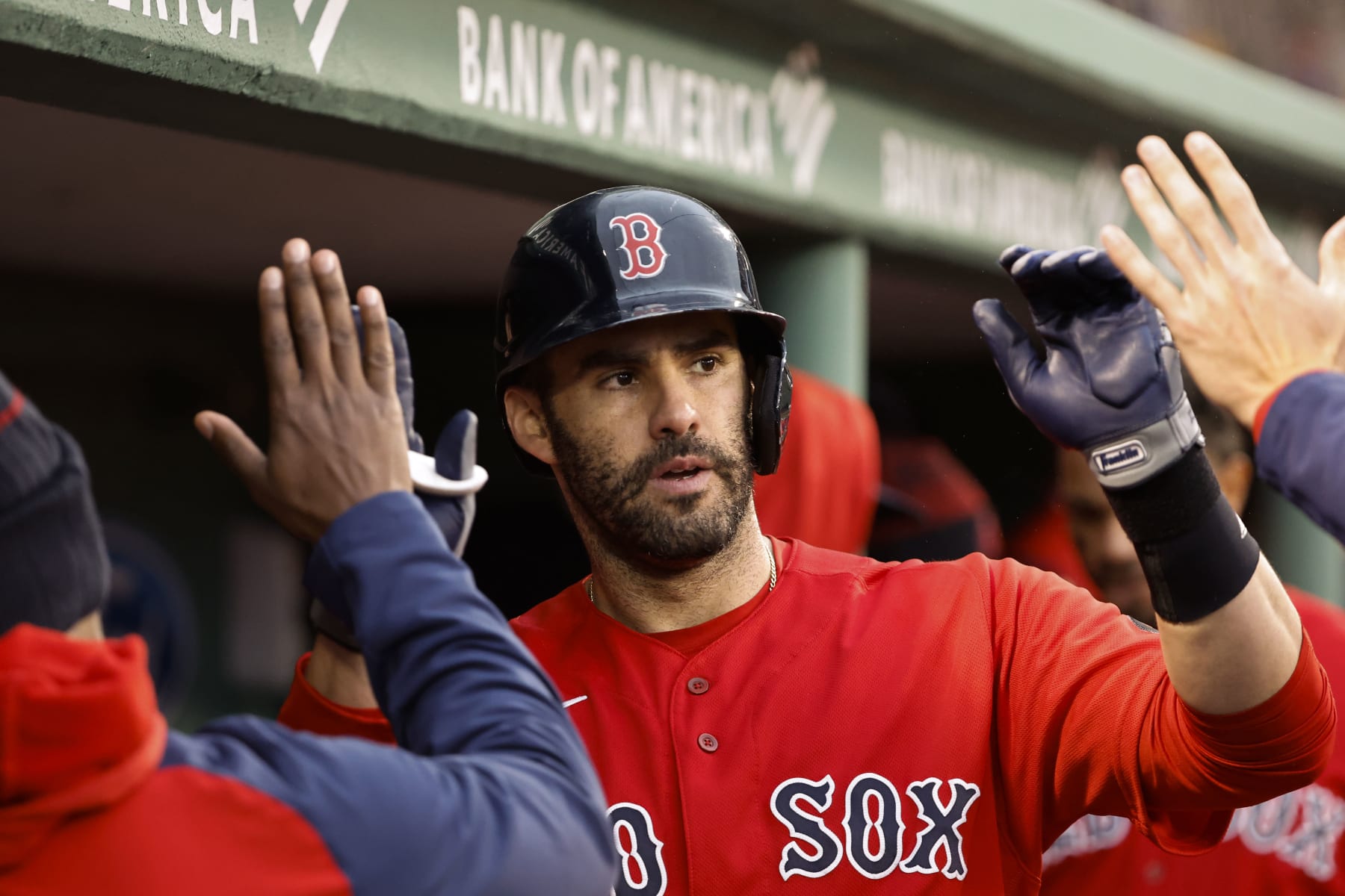 BOSTON, MA - OCTOBER 5: J.D. Martinez #28 of the Boston Red Sox is congratulated in the dugout after his home run, his second of the game, during the fourth inning against the Tampa Bay Rays at Fenway Park on October 5, 2022 in Boston, Massachusetts. (Photo By Winslow Townson/Getty Images)
