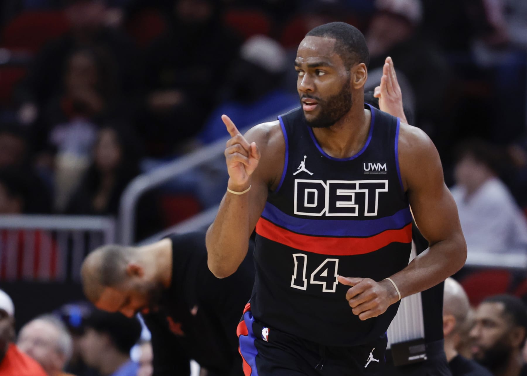 HOUSTON, TEXAS - JANUARY 01: Alec Burks #14 of the Detroit Pistons reacts to a three point basket against the Houston Rockets during the first half at Toyota Center on January 01, 2024 in Houston, Texas. NOTE TO USER: User expressly acknowledges and agrees that, by downloading and or using this photograph, User is consenting to the terms and conditions of the Getty Images License Agreement. (Photo by Carmen Mandato/Getty Images)