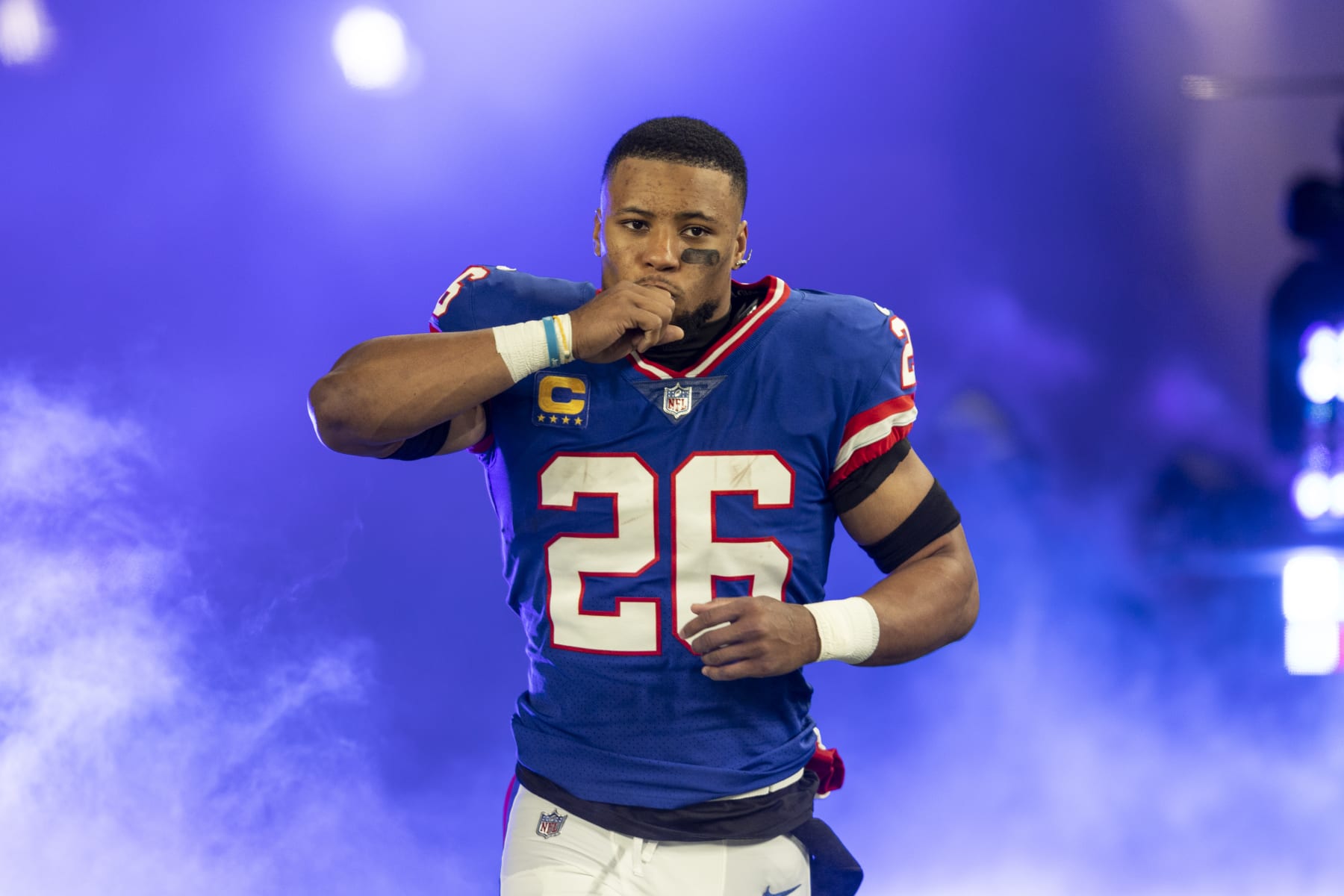 EAST RUTHERFORD, NEW JERSEY - DECEMBER 11: Saquon Barkley #26 of the New York Giants reacts as he takes the field prior to an NFL football game between the New York Giants and the Green Bay Packers at MetLife Stadium on December 11, 2023 in East Rutherford, New Jersey. (Photo by Michael Owens/Getty Images)