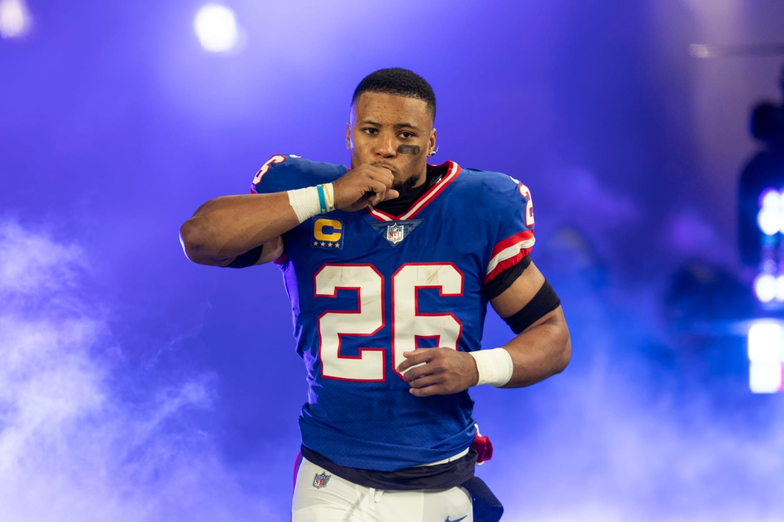 EAST RUTHERFORD, NEW JERSEY - DECEMBER 11: Saquon Barkley #26 of the New York Giants reacts as he takes the field prior to an NFL football game between the New York Giants and the Green Bay Packers at MetLife Stadium on December 11, 2023 in East Rutherford, New Jersey. (Photo by Michael Owens/Getty Images)