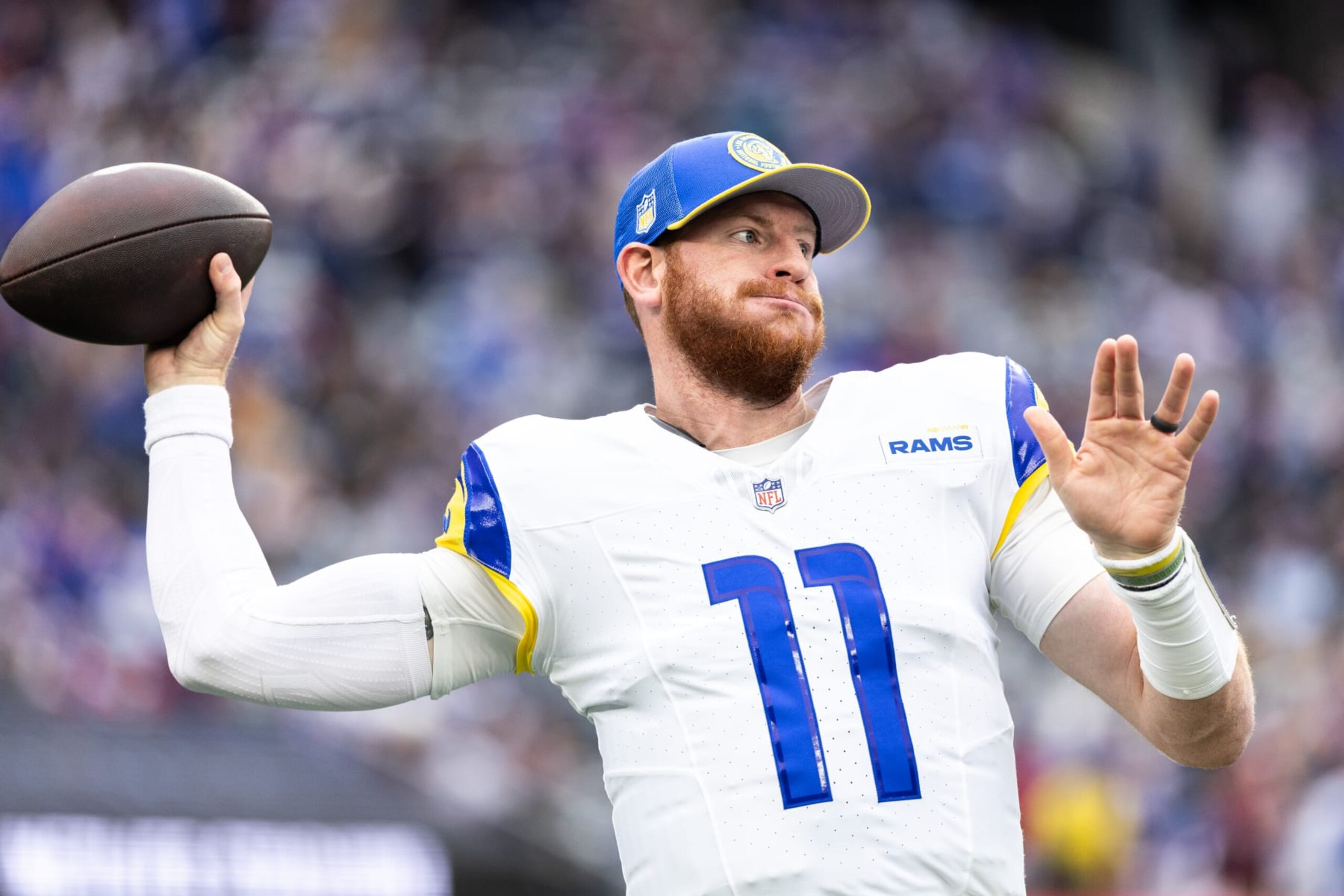 EAST RUTHERFORD, NEW JERSEY - DECEMBER 31: Carson Wentz #11 of the Los Angeles Rams warms up before the game against the New York Giants at MetLife Stadium on December 31, 2023 in East Rutherford, New Jersey. (Photo by Dustin Satloff/Getty Images)