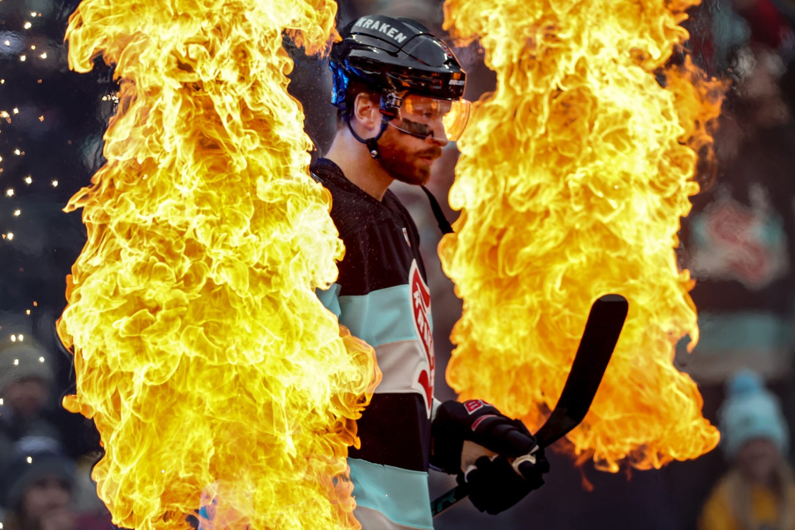 Seattle's Adam Larsson walks through the flames ahead of the Winter Classic.