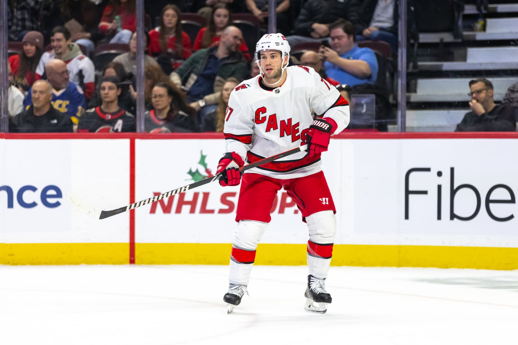 OTTAWA, ON - DECEMBER 12: Carolina Hurricanes Defenceman Tony DeAngelo (77) keeps eyes on the play during first period National Hockey League action between the Carolina Hurricanes and Ottawa Senators on December 12, 2023, at Canadian Tire Centre in Ottawa, ON, Canada. (Photo by Richard A. Whittaker/Icon Sportswire via Getty Images)