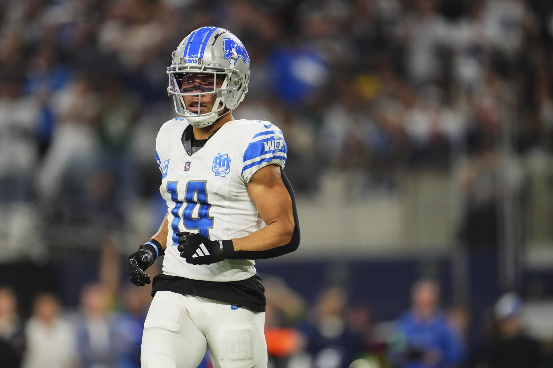 ARLINGTON, TX - DECEMBER 30: Amon-Ra St. Brown #14 of the Detroit Lions jogs onto the field against the Dallas Cowboys during the second half at AT&T Stadium on December 30, 2023 in Arlington, Texas. (Photo by Cooper Neill/Getty Images)