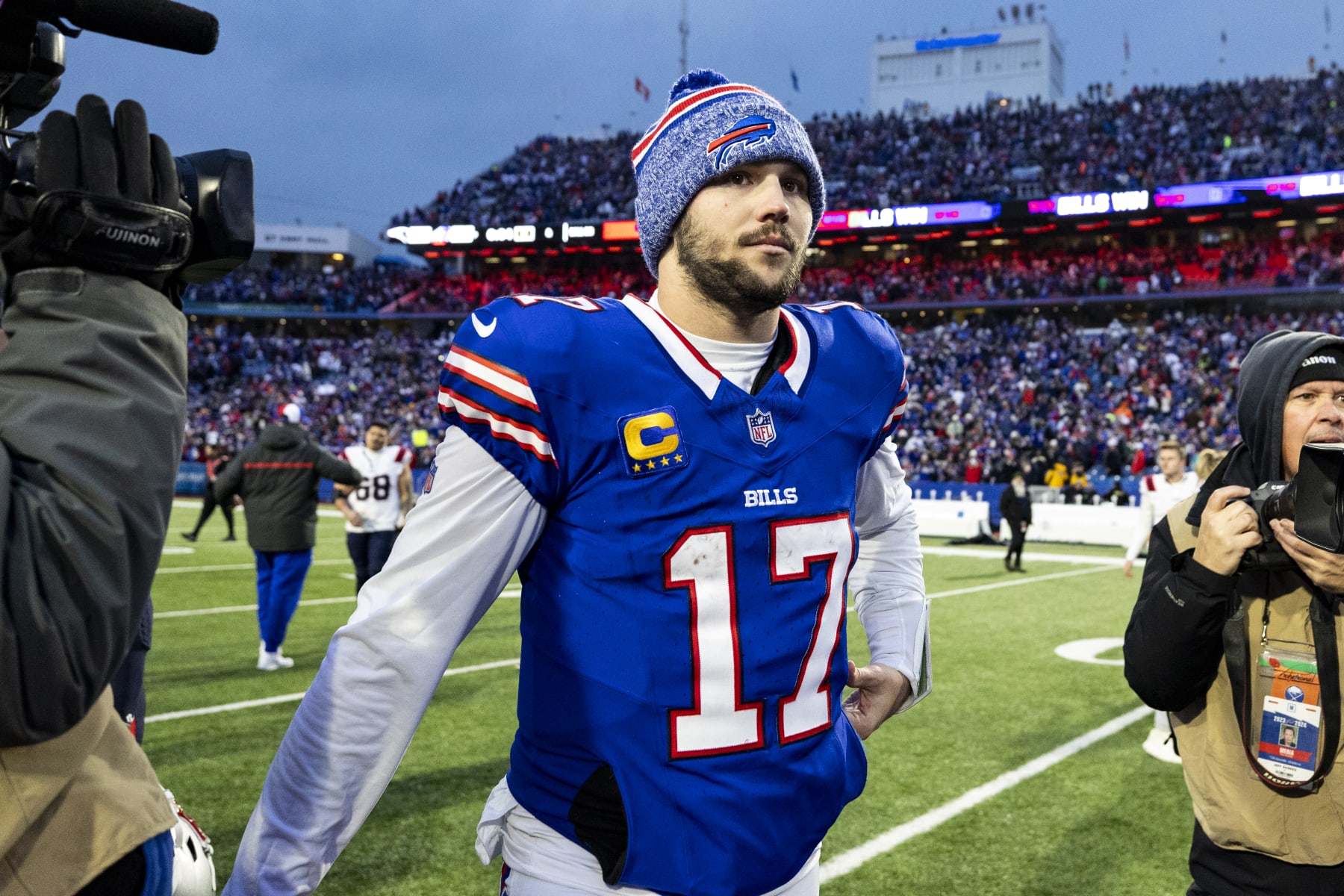 BUFFALO, NEW YORK - DECEMBER 31: Josh Allen #17 of the Buffalo Bills walks off of the field after the game against the New England Patriots at Highmark Stadium on December 31, 2023 in Buffalo, New York. The Bills beat the Patriots 27-21. (Photo by Lauren Leigh Bacho/Getty Images)