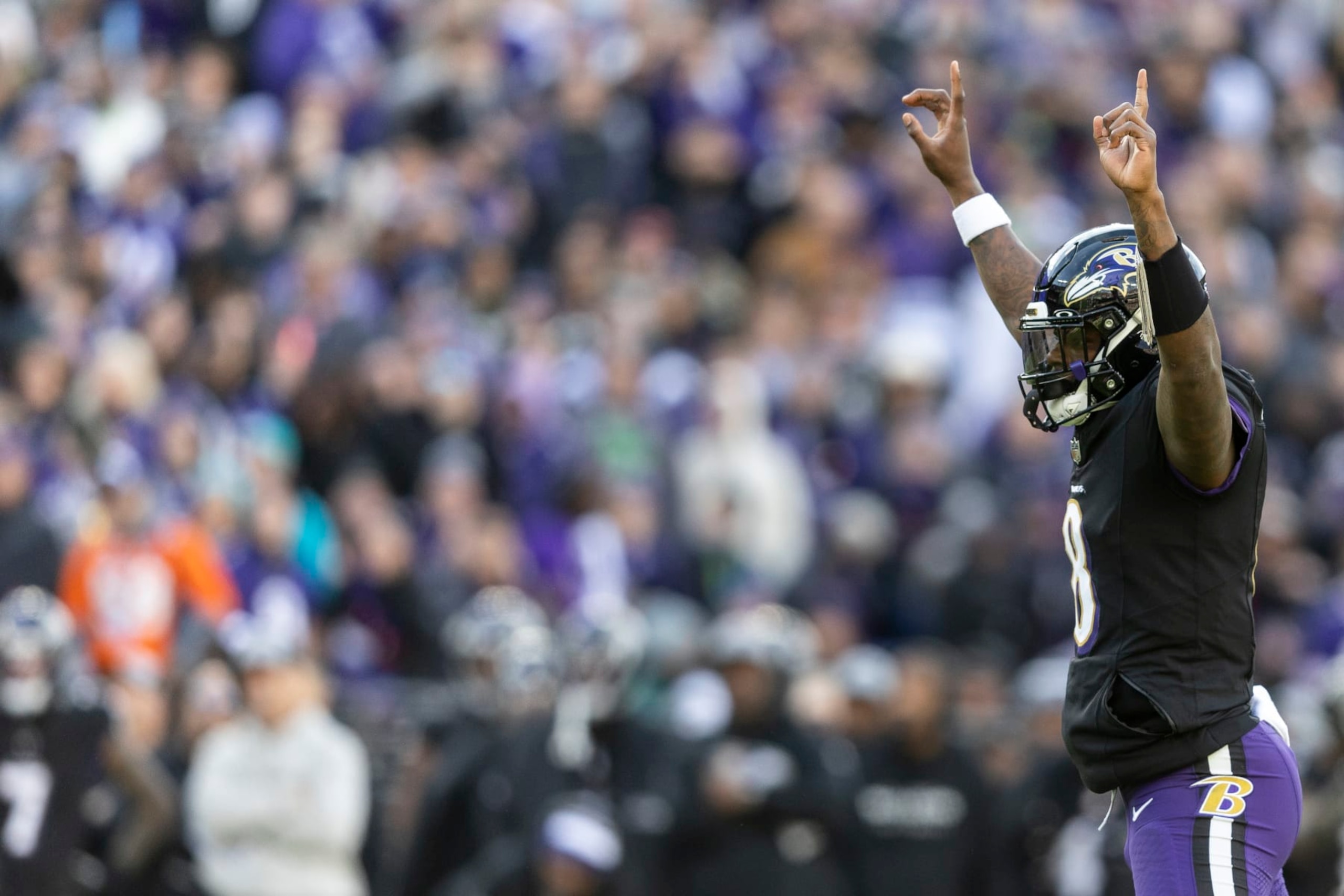 BALTIMORE, MARYLAND - DECEMBER 31: Lamar Jackson #8 of the Baltimore Ravens celebrates after a touchdown during an NFL football game between the Baltimore Ravens and the Miami Dolphins at M&T Bank Stadium on December 31, 2023 in Baltimore, Maryland. (Photo by Michael Owens/Getty Images)