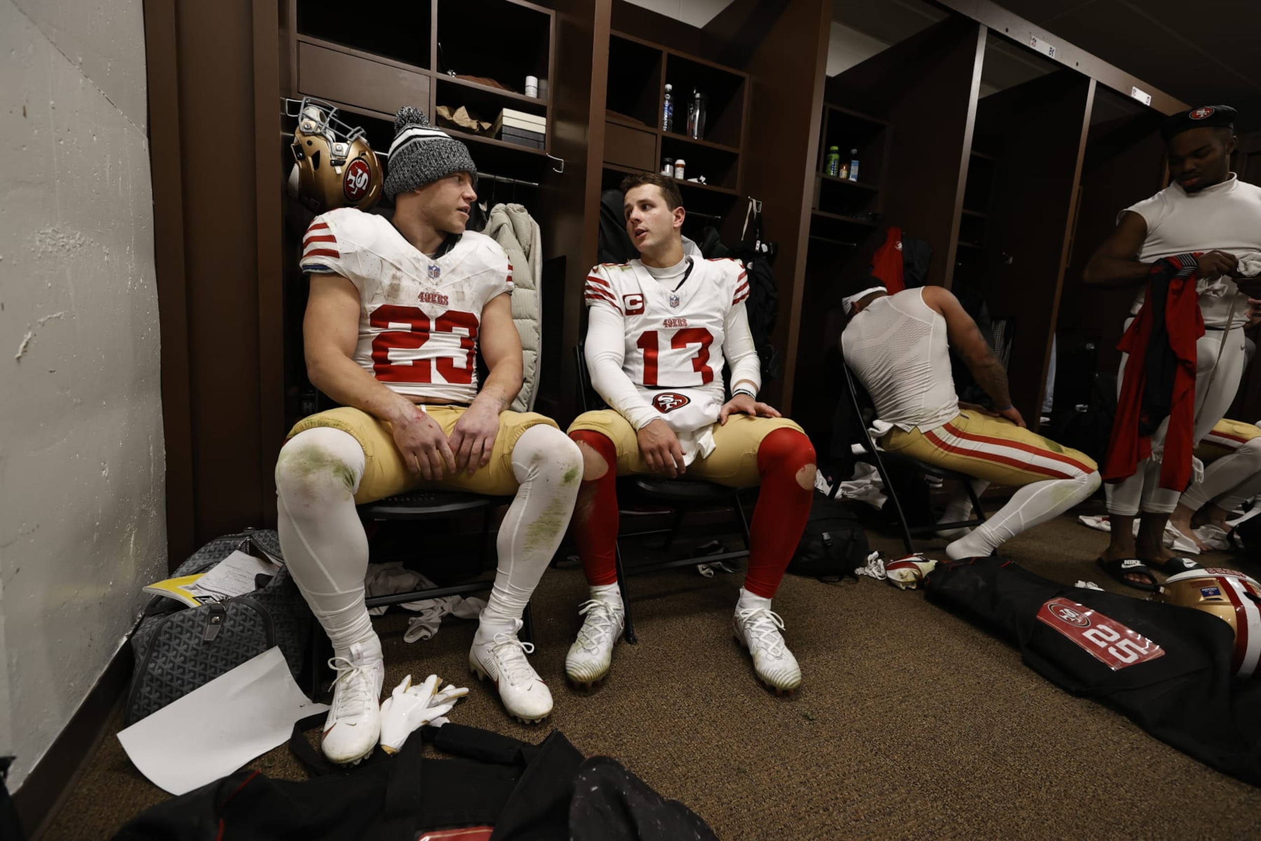 LANDOVER, MD - DECEMBER 31: Christian McCaffrey #23 and Brock Purdy #13 of the San Francisco 49ers in the locker room after the game against the Washington Commanders at FedEx Field on December 31, 2023 in Landover, Maryland. The 49ers defeated the Commanders 27-10. (Photo by Michael Zagaris/San Francisco 49ers/Getty Images)