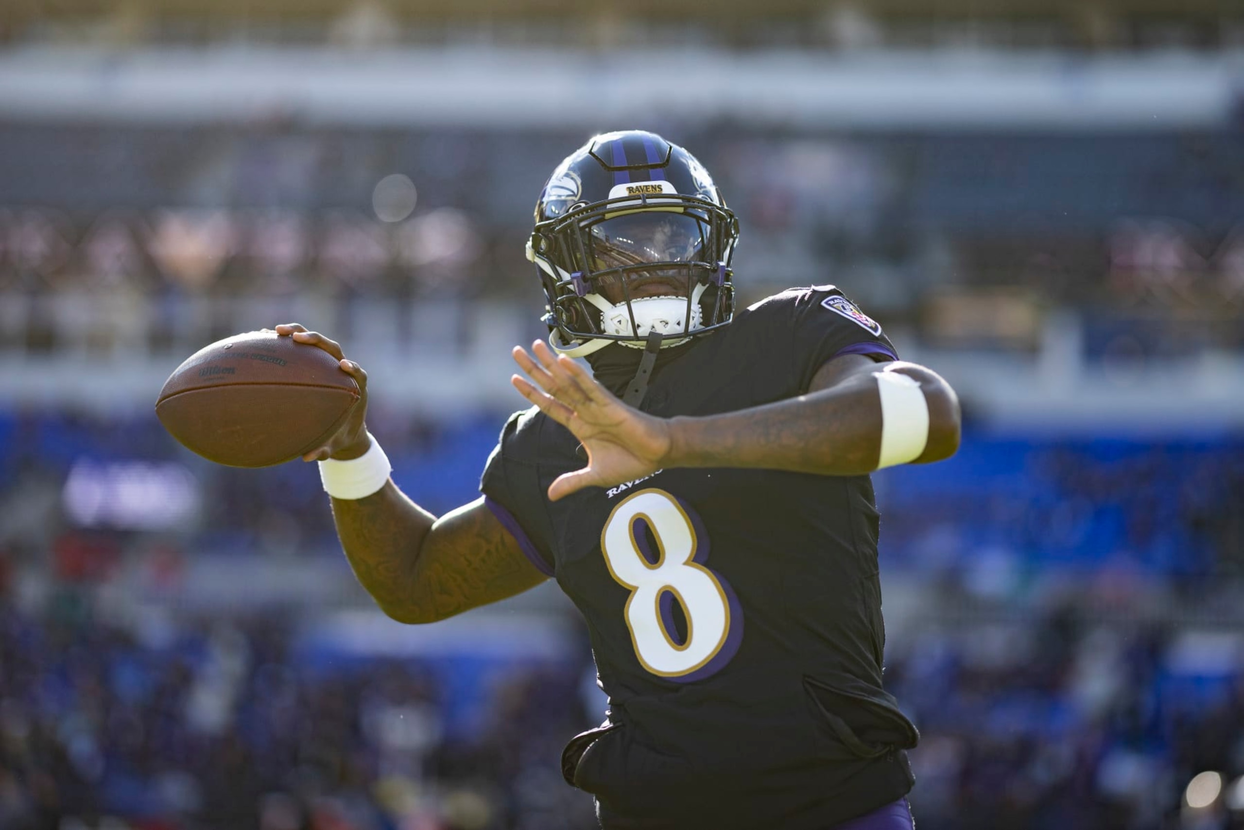 BALTIMORE, MARYLAND - DECEMBER 31: Lamar Jackson #8 of the Baltimore Ravens looks to pass as he warms up prior to an NFL football game between the Baltimore Ravens and the Miami Dolphins at M&T Bank Stadium on December 31, 2023 in Baltimore, Maryland. (Photo by Michael Owens/Getty Images)