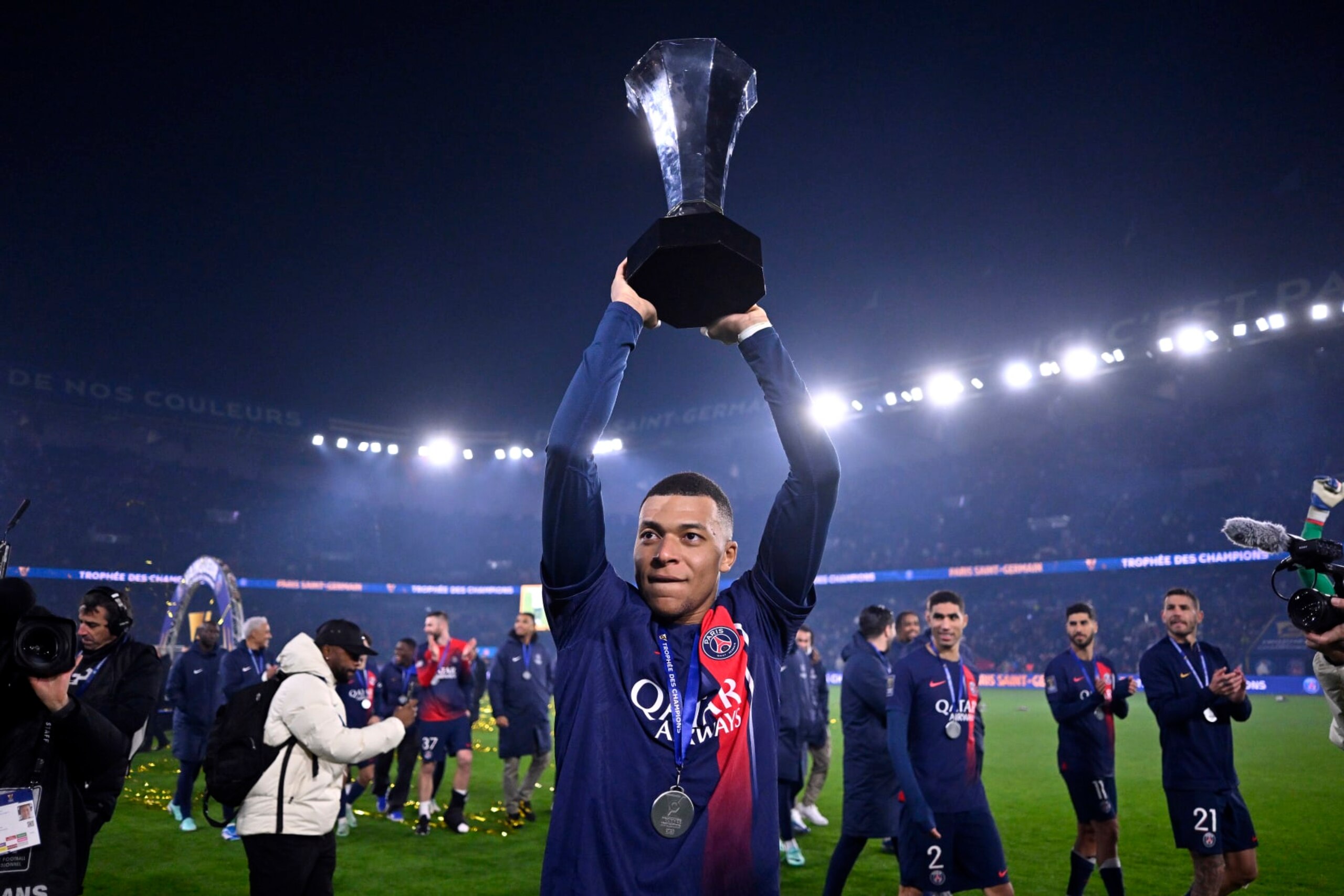 PARIS, FRANCE - JANUARY 03: Kylian Mbappe of Paris Saint-Germain reacts with the trophy after winning the Trophy Of Champions against Toulouse FC at Parc des Princes on January 03, 2024 in Paris, France. (Photo by Aurelien Meunier - PSG/PSG via Getty Images)