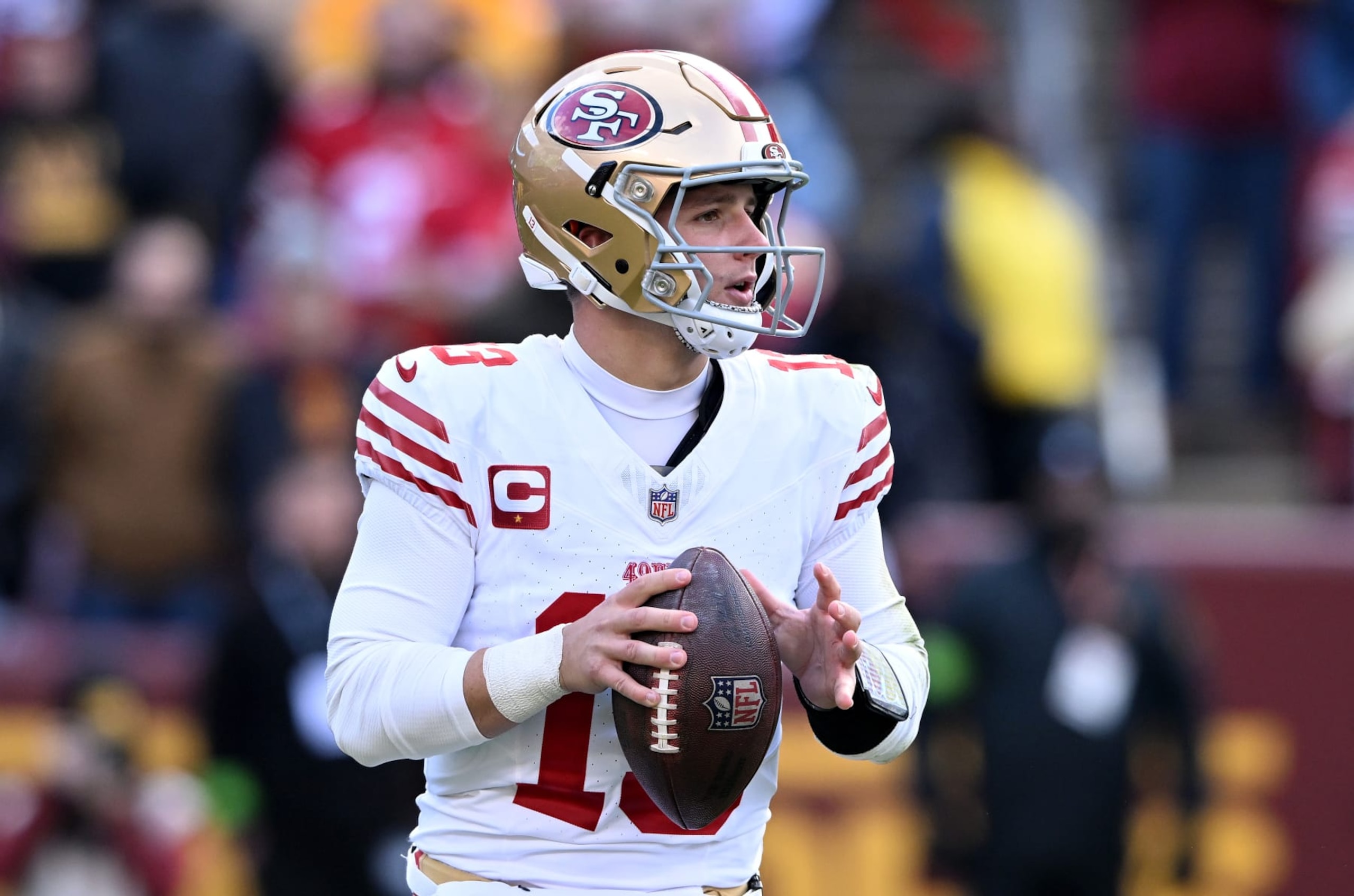LANDOVER, MARYLAND - DECEMBER 31: Brock Purdy #13 of the San Francisco 49ers drops back to pass against the Washington Commanders at FedExField on December 31, 2023 in Landover, Maryland. (Photo by G Fiume/Getty Images)