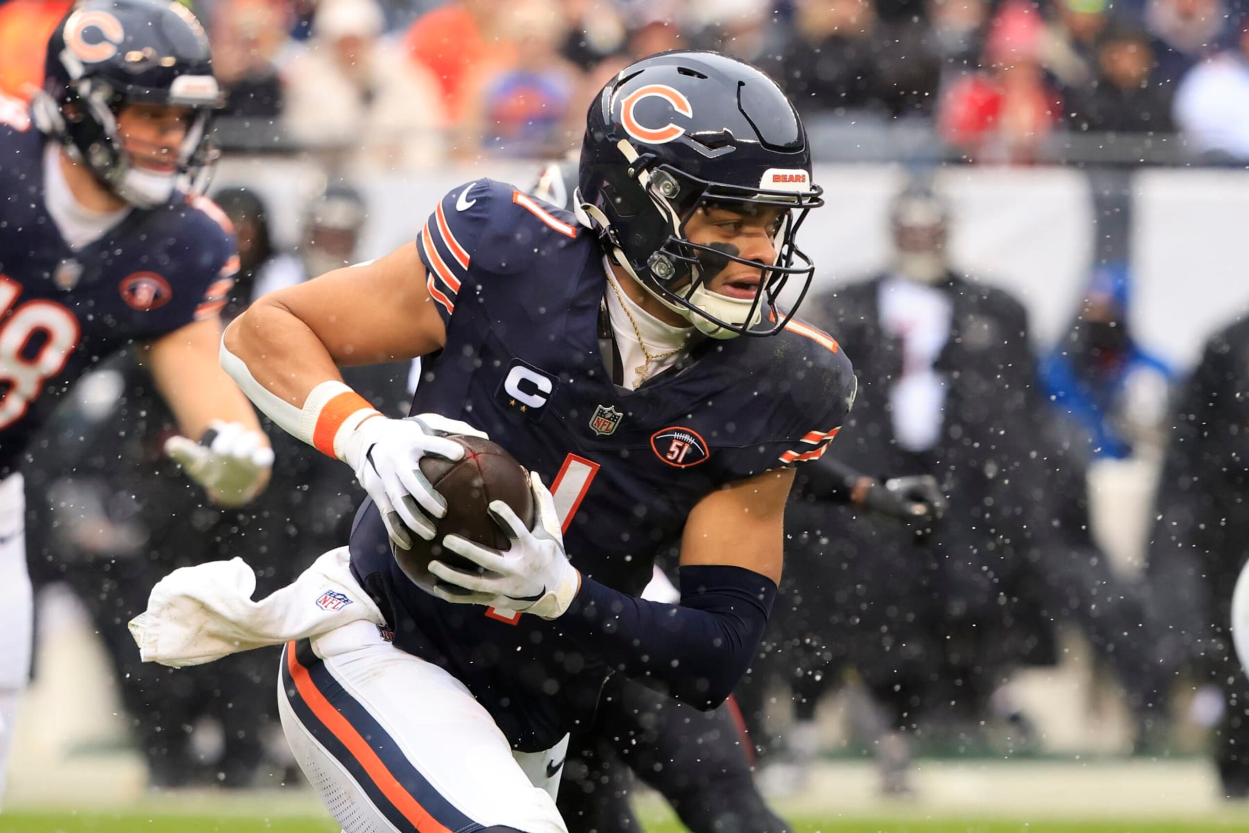 CHICAGO, ILLINOIS - DECEMBER 31: Justin Fields #1 of the Chicago Bears scrambles in the game against the Atlanta Falcons at Soldier Field on December 31, 2023 in Chicago, Illinois. (Photo by Justin Casterline/Getty Images)
