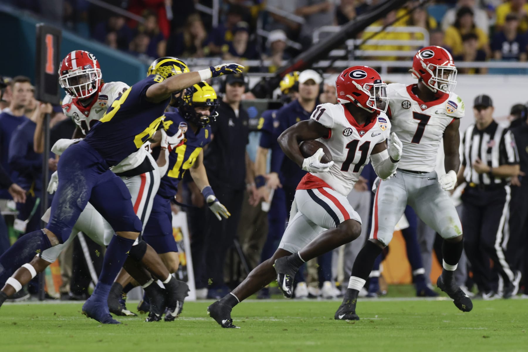 MIAMI GARDENS, FL - DECEMBER 31: Georgia Bulldogs defensive back Derion Kendrick (11) returns an interception during the Capital One Orange Bowl game between the Georgia Bulldogs and the Michigan Wolverines on December 31, 2021 at Hard Rock Stadium in Miami Gardens, Fl. (Photo by David Rosenblum/Icon Sportswire via Getty Images) MIAMI GARDENS, FL - DECEMBER 31: Georgia Bulldogs defensive back Derion Kendrick (11) returns an interception during the Capital One Orange Bowl game between the Georgia Bulldogs and the Michigan Wolverines on December 31, 2021 at Hard Rock Stadium in Miami Gardens, Fl. (Photo by David Rosenblum/Icon Sportswire via Getty Images)