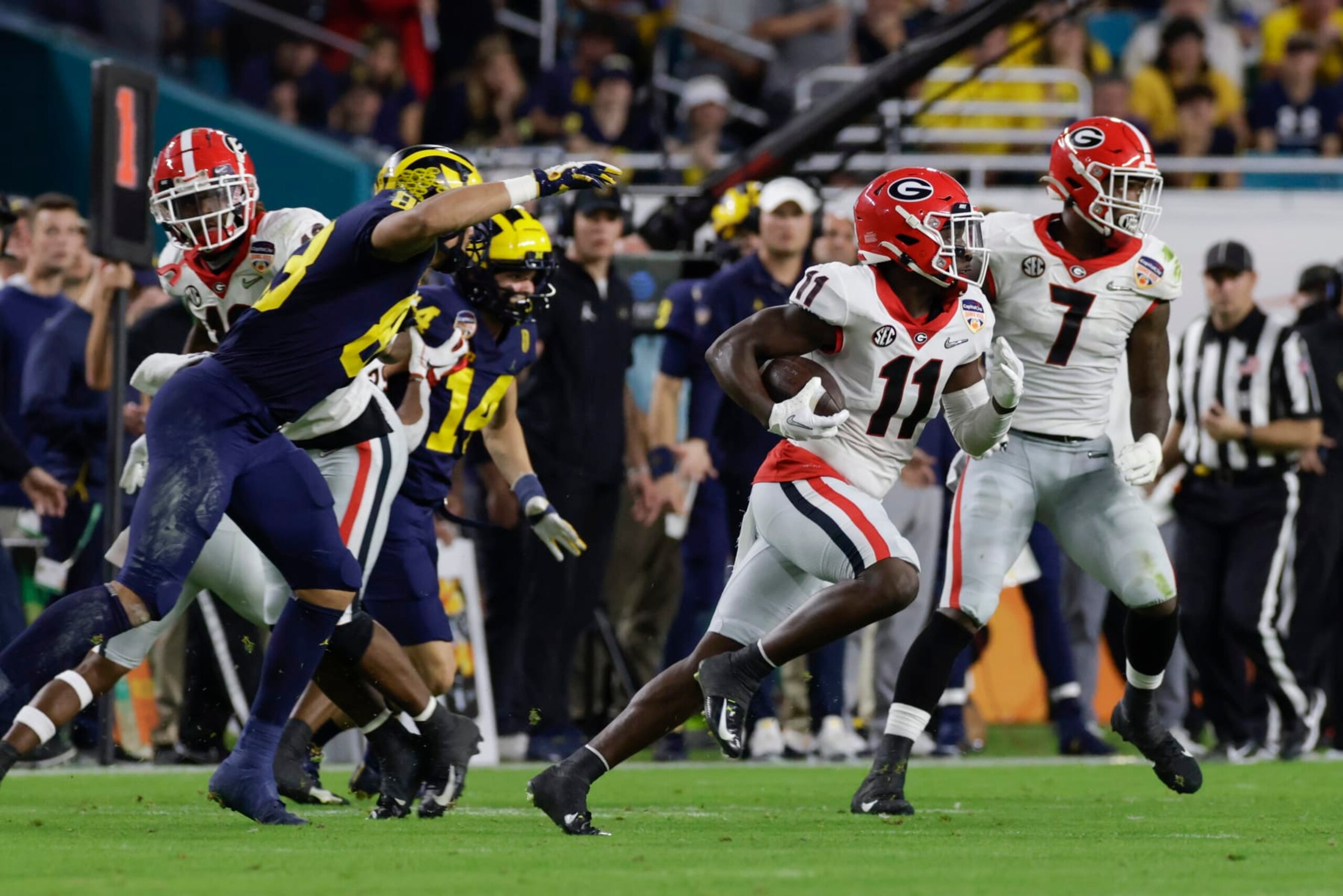 MIAMI GARDENS, FL - DECEMBER 31: Georgia Bulldogs defensive back Derion Kendrick (11) returns an interception during the Capital One Orange Bowl game between the Georgia Bulldogs and the Michigan Wolverines on December 31, 2021 at Hard Rock Stadium in Miami Gardens, Fl. (Photo by David Rosenblum/Icon Sportswire via Getty Images) MIAMI GARDENS, FL - DECEMBER 31: Georgia Bulldogs defensive back Derion Kendrick (11) returns an interception during the Capital One Orange Bowl game between the Georgia Bulldogs and the Michigan Wolverines on December 31, 2021 at Hard Rock Stadium in Miami Gardens, Fl. (Photo by David Rosenblum/Icon Sportswire via Getty Images)