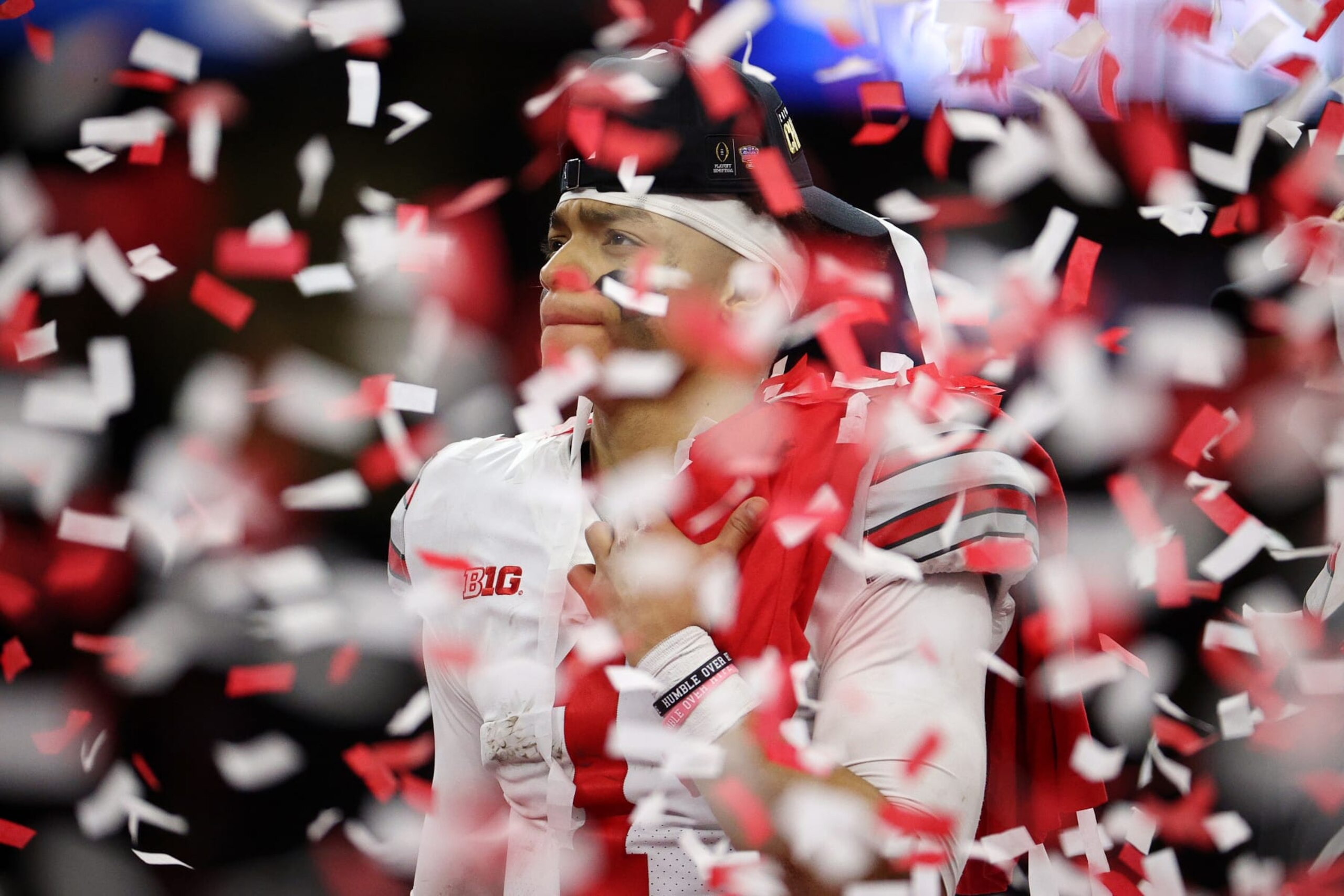 NEW ORLEANS, LOUISIANA - JANUARY 01: Confetti falls on Justin Fields #1 after the Ohio State Buckeyes defeated the Clemson Tigers during the College Football Playoff semifinal game at the Allstate Sugar Bowl at Mercedes-Benz Superdome on January 01, 2021 in New Orleans, Louisiana. (Photo by Chris Graythen/Getty Images) NEW ORLEANS, LOUISIANA - JANUARY 01: Confetti falls on Justin Fields #1 after the Ohio State Buckeyes defeated the Clemson Tigers during the College Football Playoff semifinal game at the Allstate Sugar Bowl at Mercedes-Benz Superdome on January 01, 2021 in New Orleans, Louisiana. (Photo by Chris Graythen/Getty Images)