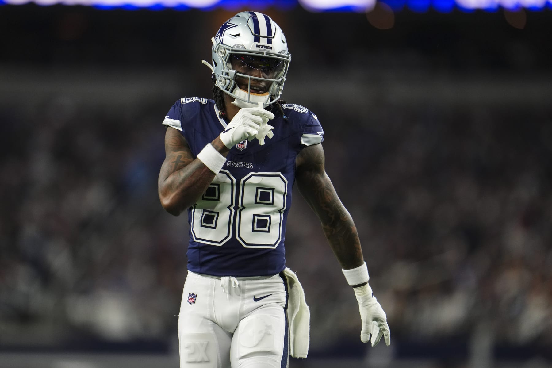 ARLINGTON, TX - DECEMBER 30: CeeDee Lamb #88 of the Dallas Cowboys looks on from the field during an NFL football game against the Detroit Lions at AT&T Stadium on December 30, 2023 in Arlington, Texas. (Photo by Cooper Neill/Getty Images)