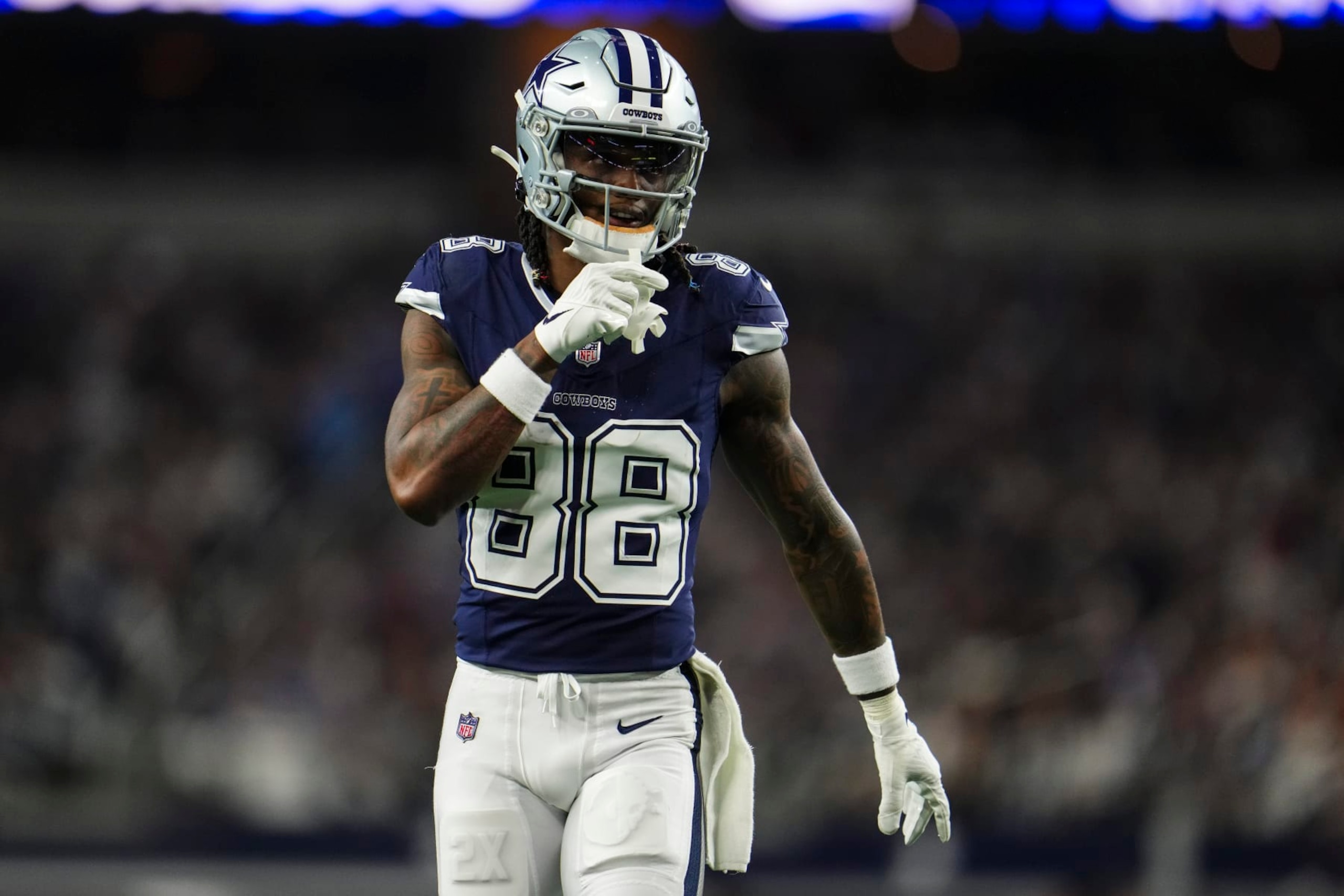 ARLINGTON, TX - DECEMBER 30: CeeDee Lamb #88 of the Dallas Cowboys looks on from the field during an NFL football game against the Detroit Lions at AT&T Stadium on December 30, 2023 in Arlington, Texas. (Photo by Cooper Neill/Getty Images)