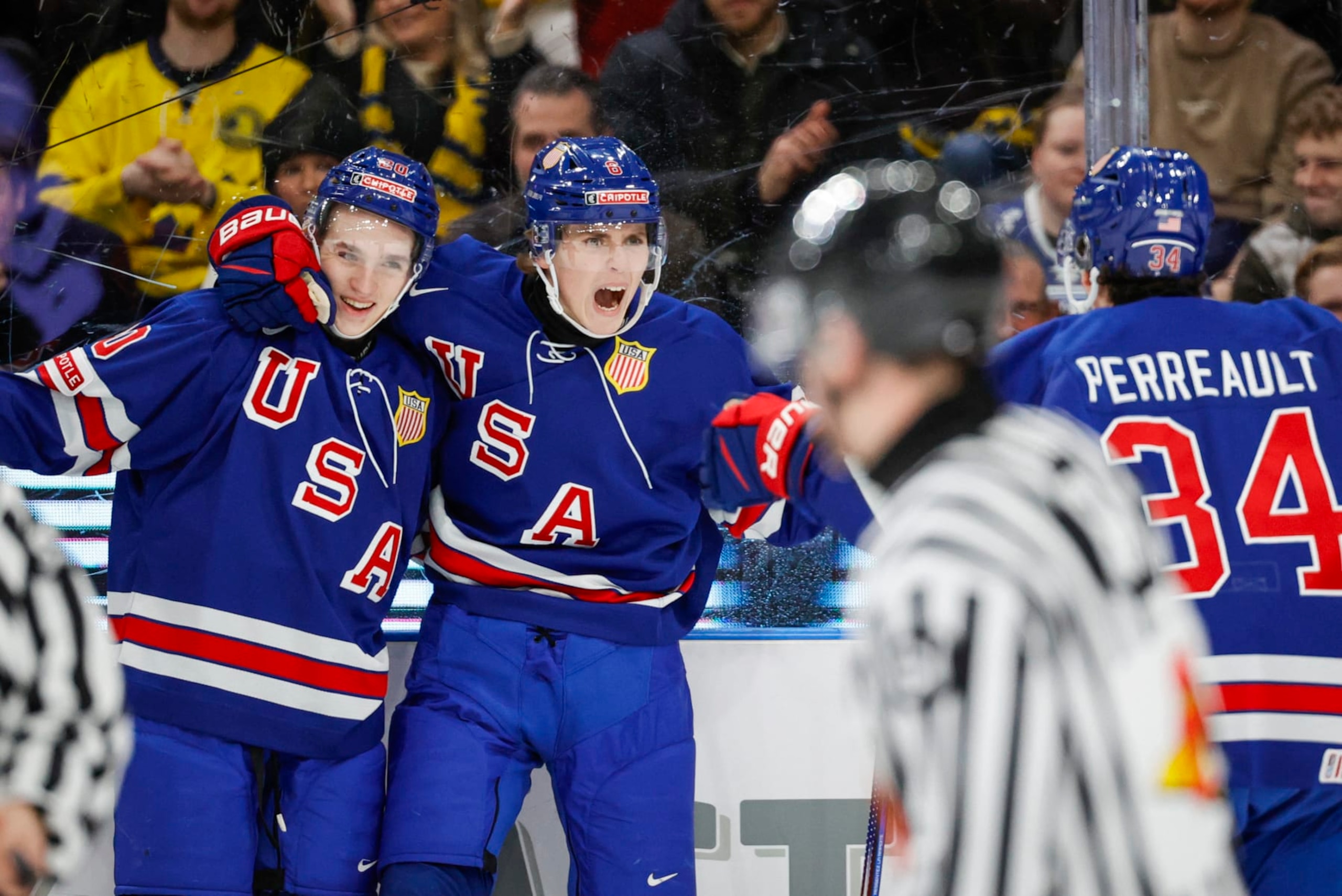 USA's forward Will Smith celebrates with teammates scoring during the semi-final match between USA and Finland of the IIHF World Junior Championship in Gothenburg, Sweden on January 4, 2024. (Photo by Adam Ihse/TT / various sources / AFP) / Sweden OUT (Photo by ADAM IHSE/TT/TT News Agency/TT NYHETSBYRÅN/AFP via Getty Images)
