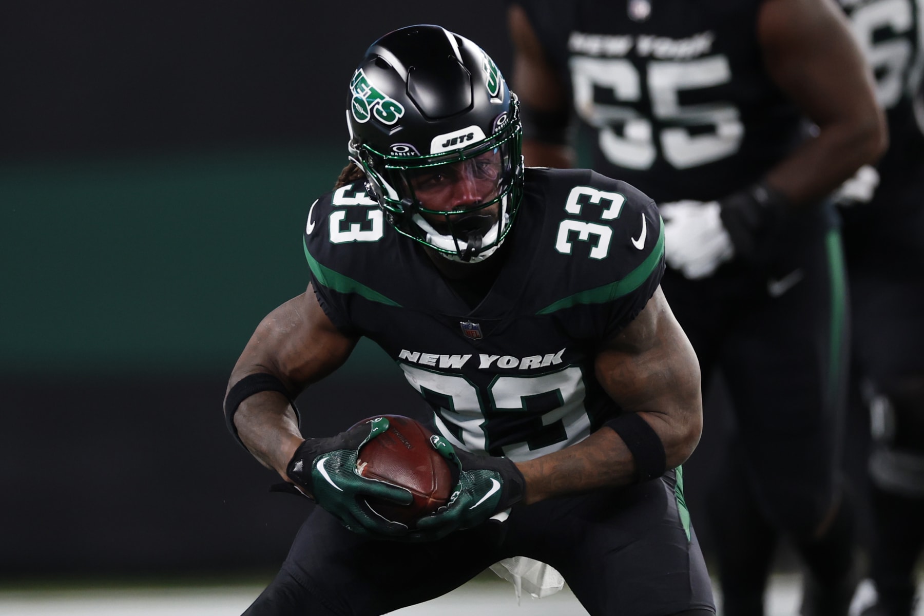 EAST RUTHERFORD, NEW JERSEY - NOVEMBER 24: Running back Dalvin Cook #33 of the New York Jets in action against the Miami Dolphins during a football game at MetLife Stadium on November 24, 2023 in East Rutherford, New Jersey. (Photo by Rich Schultz/Getty Images)