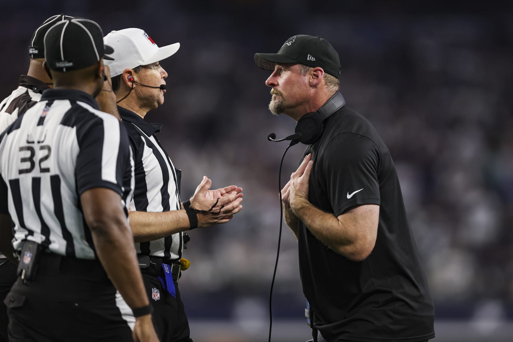 ARLINGTON, TX - DECEMBER 30: Head coach Dan Campbell of the Detroit Lions talks with referee Brad Allen during an NFL football game against the Dallas Cowboys at AT&T Stadium on December 30, 2023 in Arlington, Texas. (Photo by Perry Knotts/Getty Images)