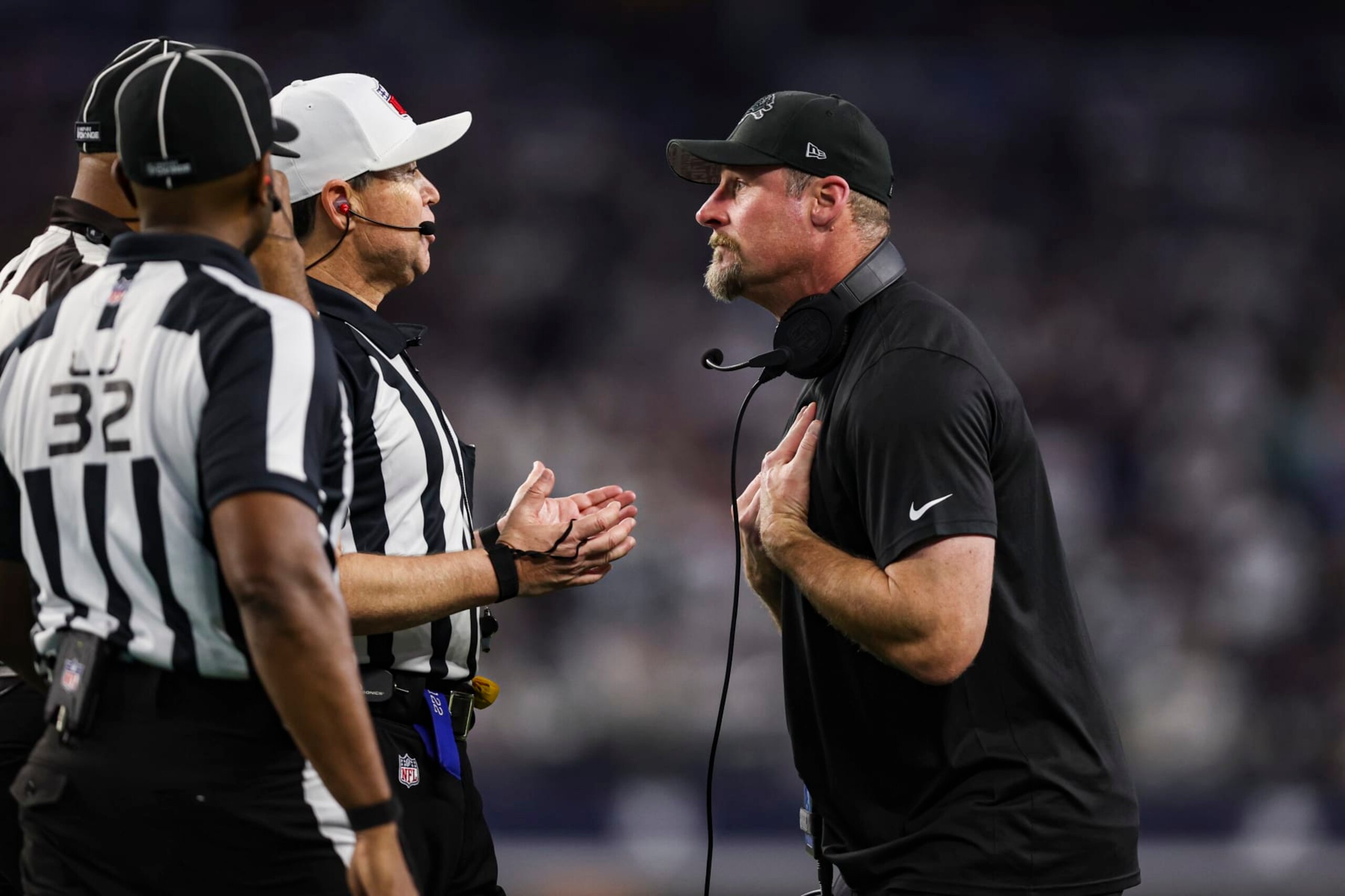 ARLINGTON, TX - DECEMBER 30: Head coach Dan Campbell of the Detroit Lions talks with referee Brad Allen during an NFL football game against the Dallas Cowboys at AT&T Stadium on December 30, 2023 in Arlington, Texas. (Photo by Perry Knotts/Getty Images)