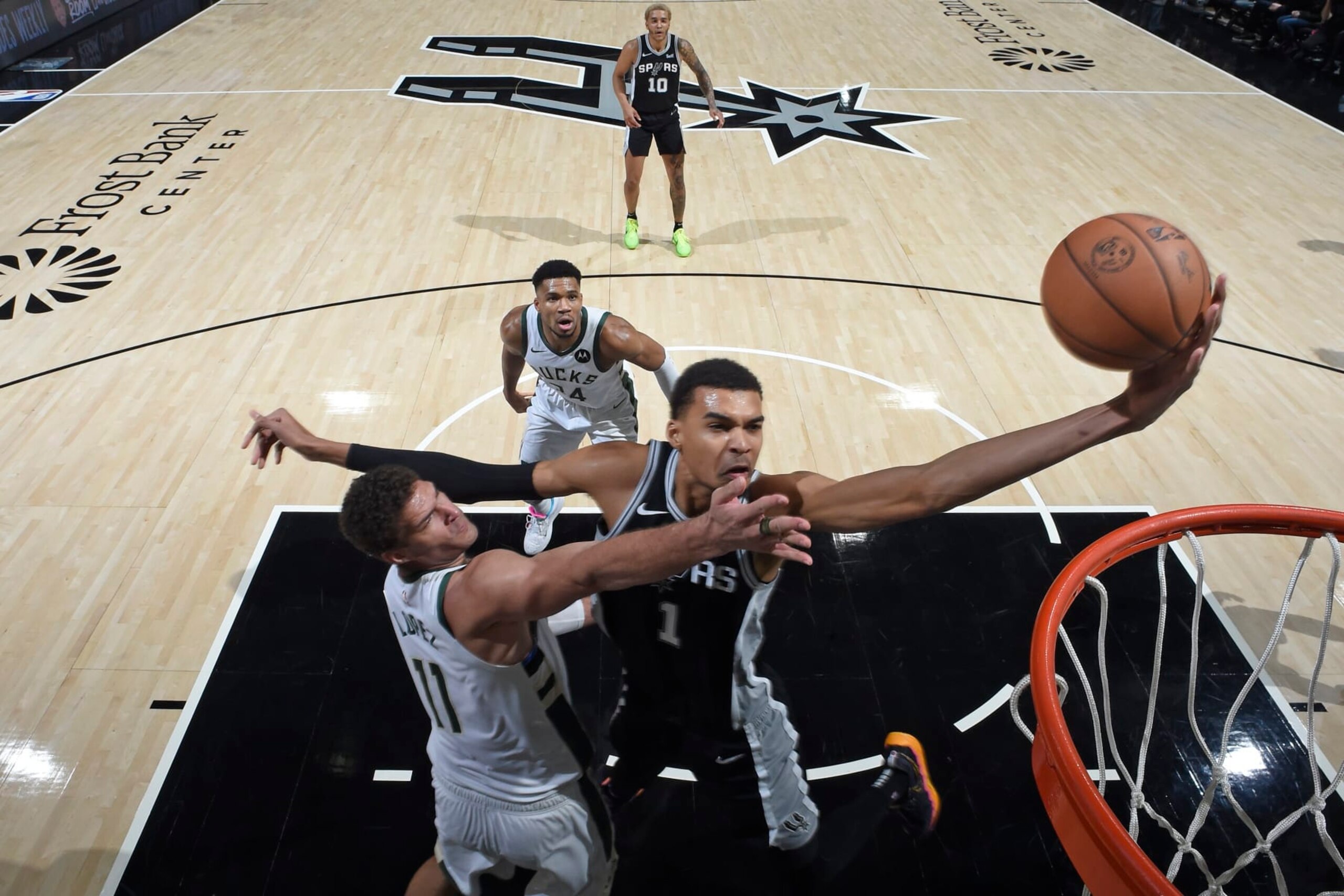 SAN ANTONIO, TX - JANUARY 4: Victor Wembanyama #1 of the San Antonio Spurs drives to the basket during the game against the Milwaukee Bucks on January 4, 2024 at the Frost Bank Center in San Antonio, Texas. NOTE TO USER: User expressly acknowledges and agrees that, by downloading and or using this photograph, User is consenting to the terms and conditions of the Getty Images License Agreement. Mandatory Copyright Notice: Copyright 2024 NBAE (Photo by Logan Riely/NBAE via Getty Images) SAN ANTONIO, TX - JANUARY 4: Victor Wembanyama #1 of the San Antonio Spurs drives to the basket during the game against the Milwaukee Bucks on January 4, 2024 at the Frost Bank Center in San Antonio, Texas. NOTE TO USER: User expressly acknowledges and agrees that, by downloading and or using this photograph, User is consenting to the terms and conditions of the Getty Images License Agreement. Mandatory Copyright Notice: Copyright 2024 NBAE (Photo by Logan Riely/NBAE via Getty Images)