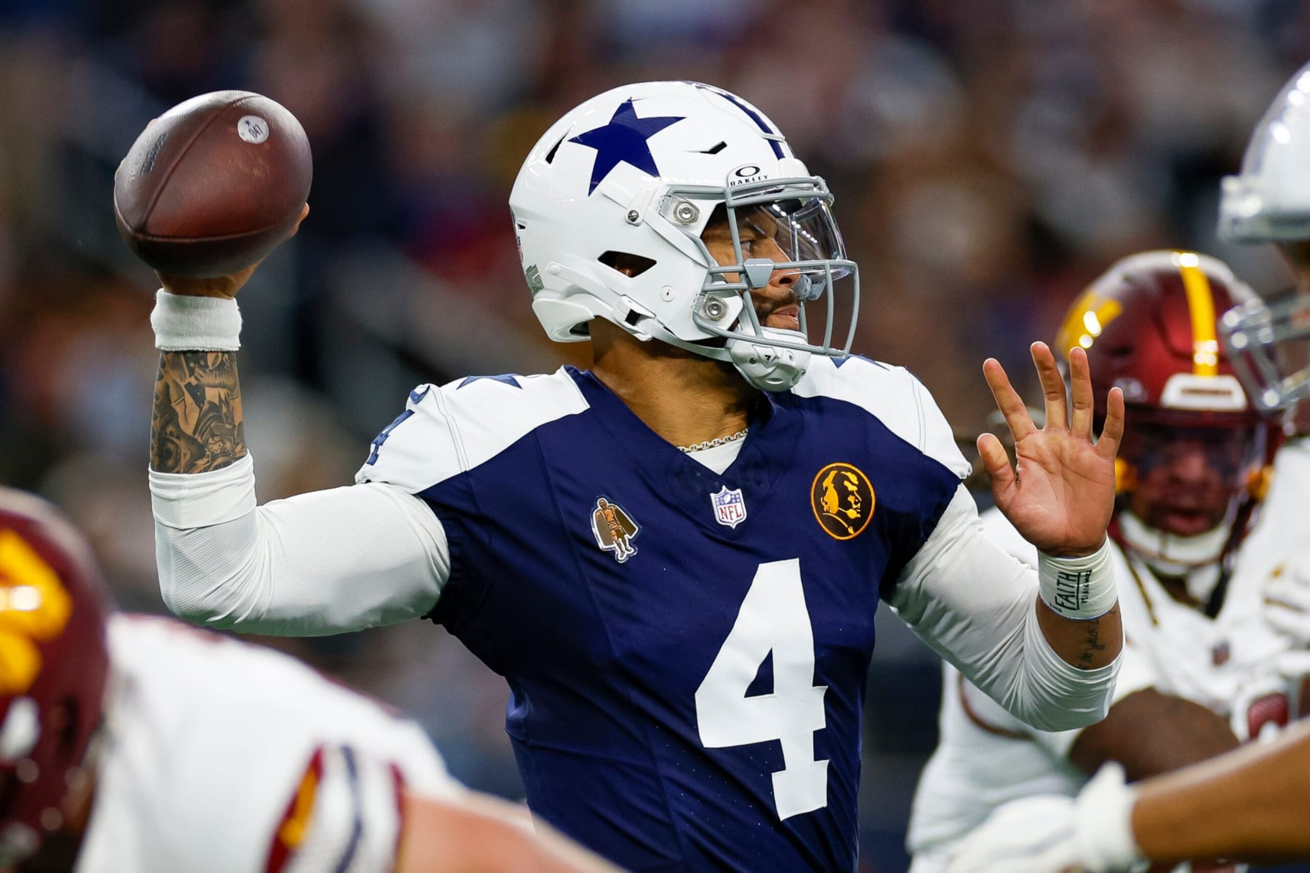 ARLINGTON, TEXAS - NOVEMBER 23: Dak Prescott #4 of the Dallas Cowboys throws a pass against the Washington Commanders during the first half at AT&T Stadium on November 23, 2023 in Arlington, Texas. (Photo by Brandon Sloter/Image Of Sport/Getty Images)