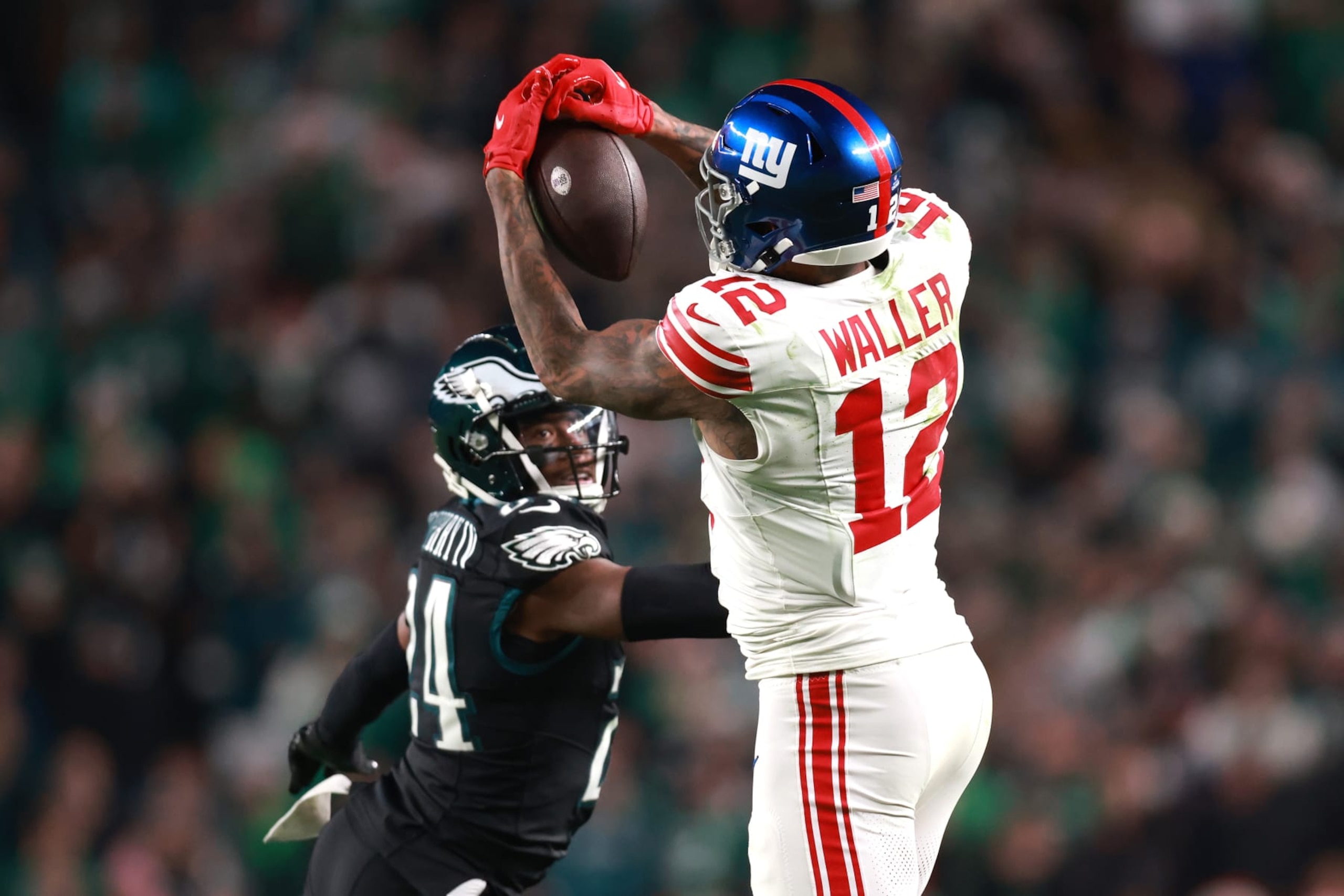 PHILADELPHIA, PENNSYLVANIA - DECEMBER 25: Darren Waller #12 of the New York Giants makes a catch against James Bradberry #24 of the Philadelphia Eagles during the fourth quarter at Lincoln Financial Field on December 25, 2023 in Philadelphia, Pennsylvania. (Photo by Dustin Satloff/Getty Images)
