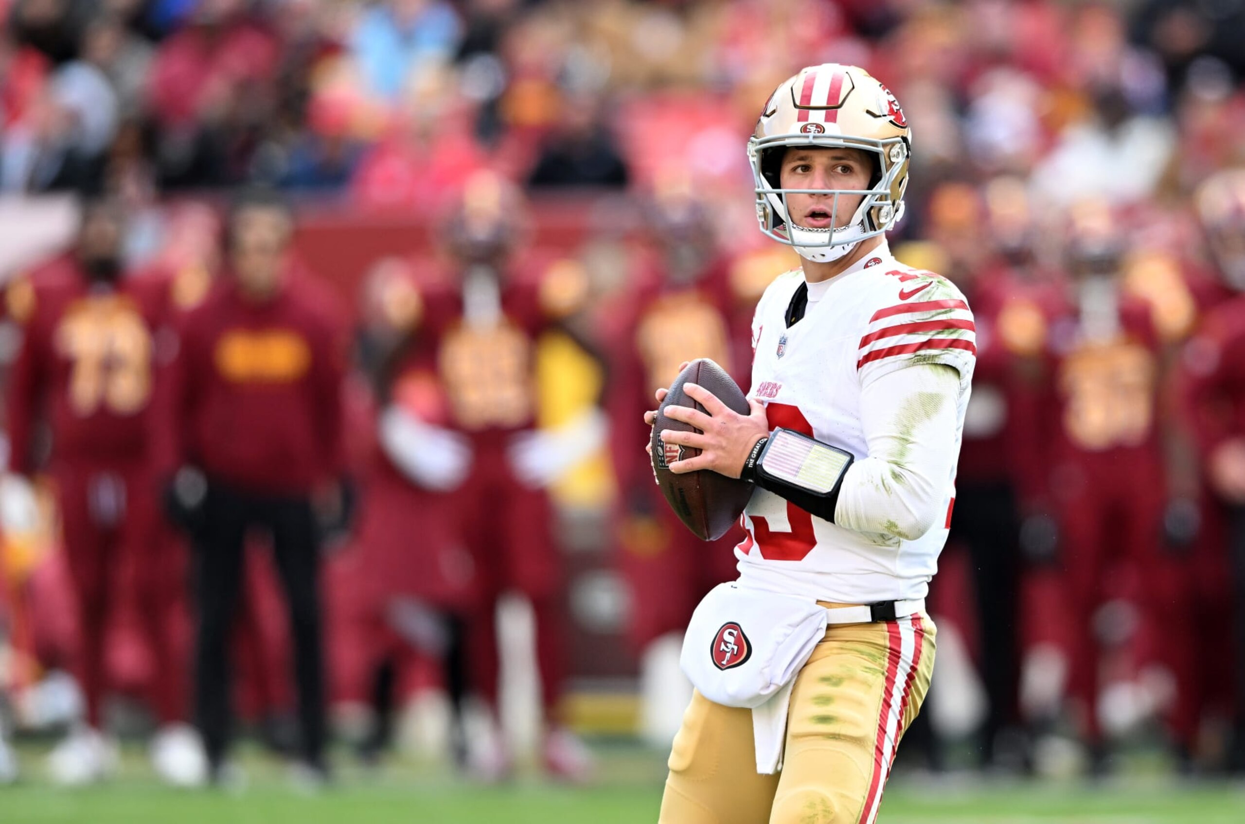 LANDOVER, MARYLAND - DECEMBER 31: Brock Purdy #13 of the San Francisco 49ers drops back to pass against the Washington Commanders at FedExField on December 31, 2023 in Landover, Maryland. (Photo by G Fiume/Getty Images)