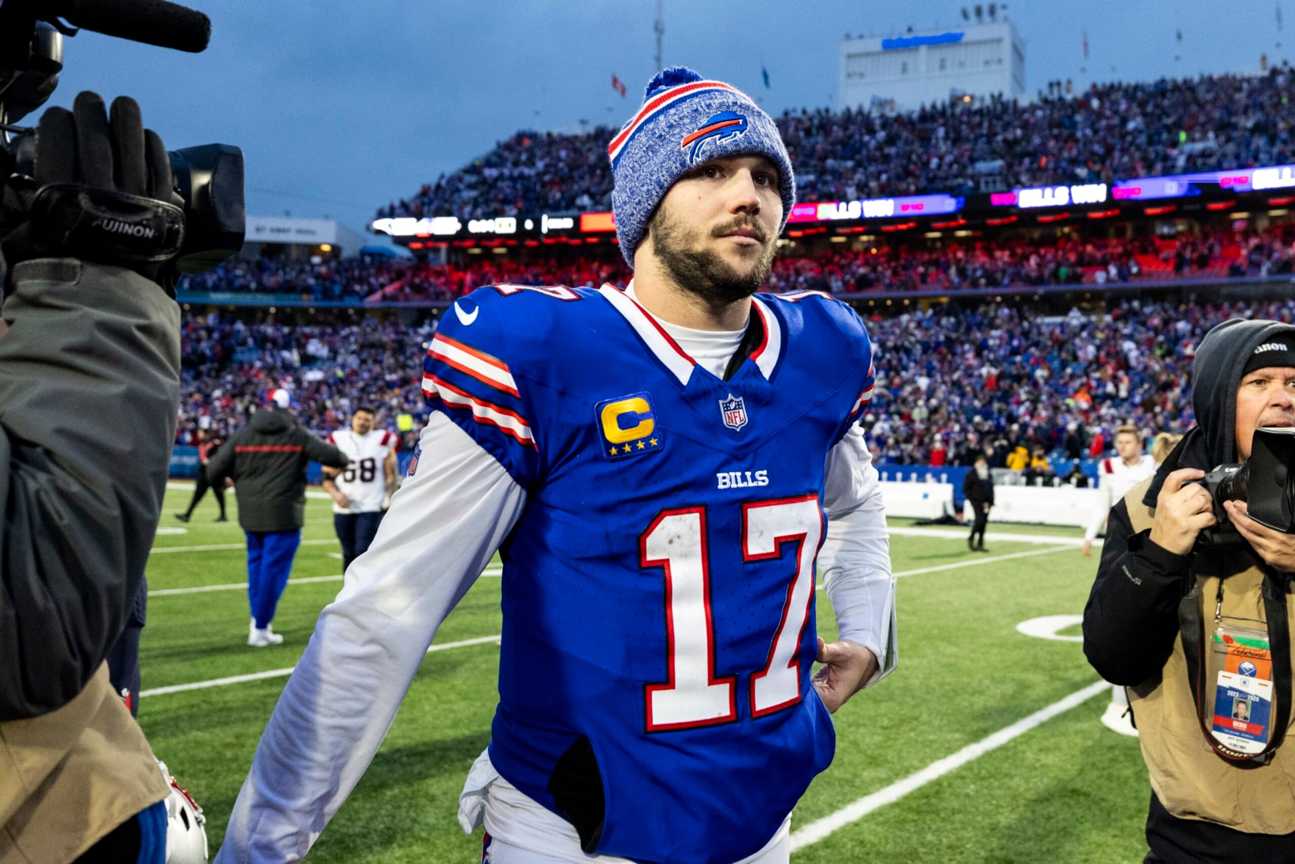 BUFFALO, NEW YORK - DECEMBER 31: Josh Allen #17 of the Buffalo Bills walks off of the field after the game against the New England Patriots at Highmark Stadium on December 31, 2023 in Buffalo, New York. The Bills beat the Patriots 27-21. (Photo by Lauren Leigh Bacho/Getty Images)