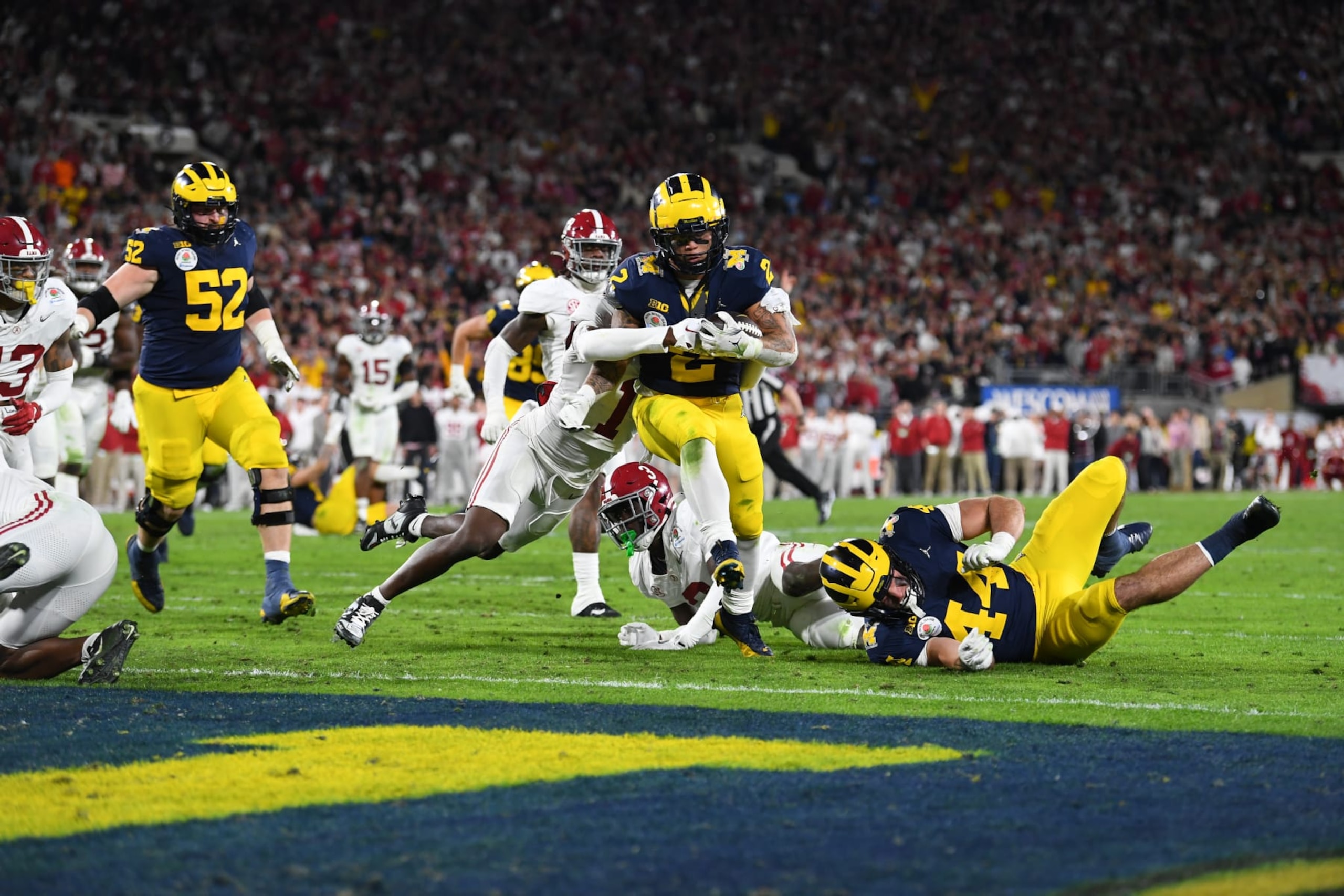 PASADENA, CA - JANUARY 01: RB Blake Corum (2) of the Michigan Wolverines scores a touchdown in overtime of the Alabama Crimson Tide game versus the Michigan Wolverines CFP Semifinal at the Rose Bowl Game on January, 1, 2024, at the Rose Bowl Stadium in Pasadena, CA. (Photo by Brian Rothmuller/Icon Sportswire via Getty Images)
