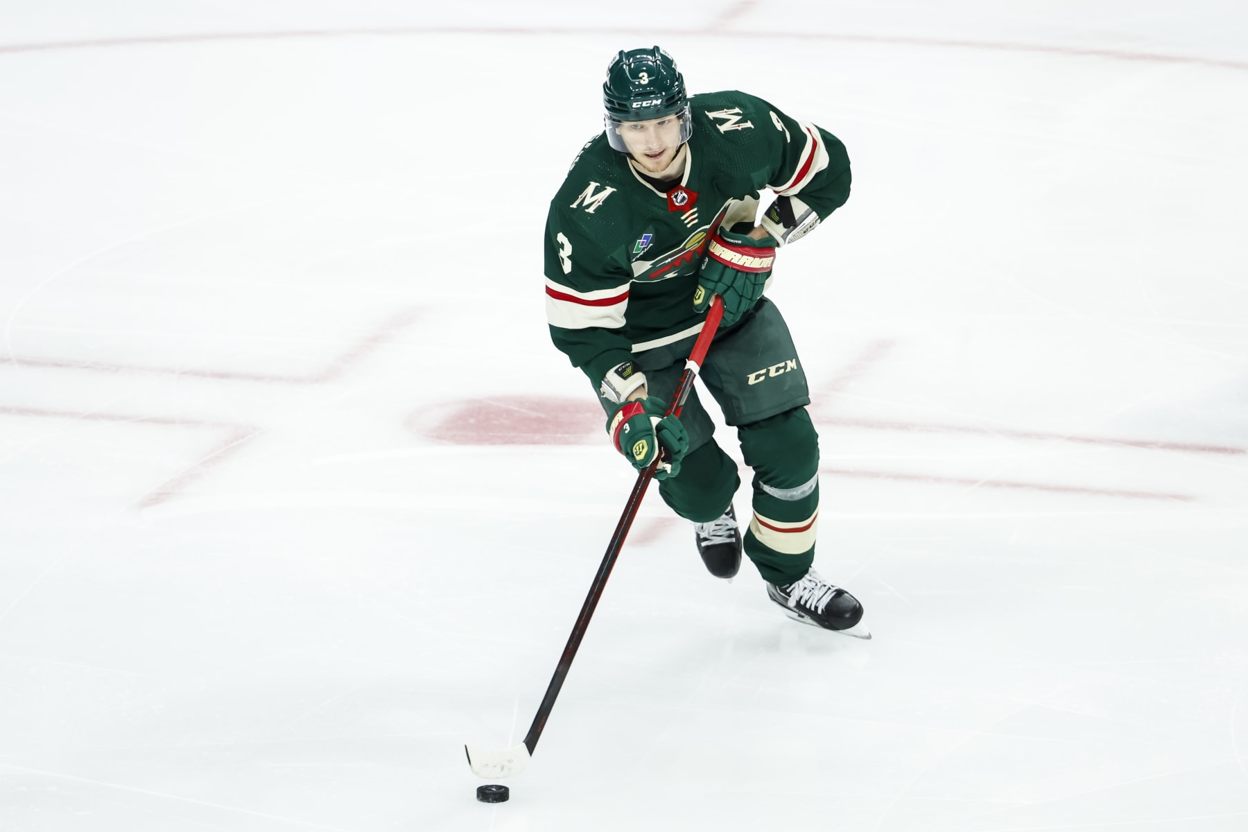 ST PAUL, MN - APRIL 28: John Klingberg #3 of the Minnesota Wild skates with the puck against the Dallas Stars in the third period in Game Six of the First Round of the 2023 Stanley Cup Playoffs at Xcel Energy Center on April 28, 2023 in St Paul, Minnesota. The Stars defeated the Wild 4-1 to advance to the Second Round. (Photo by David Berding/Getty Images)