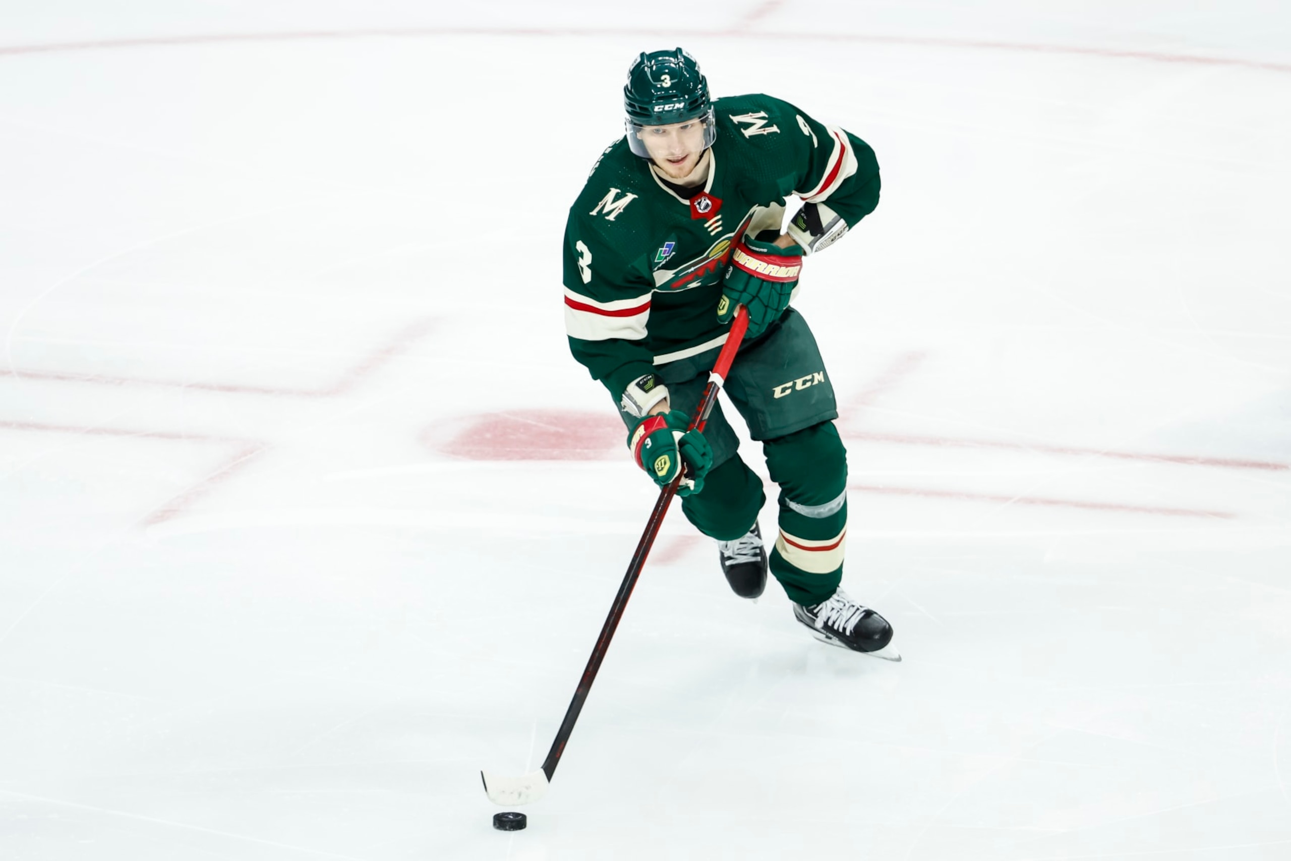 ST PAUL, MN - APRIL 28: John Klingberg #3 of the Minnesota Wild skates with the puck against the Dallas Stars in the third period in Game Six of the First Round of the 2023 Stanley Cup Playoffs at Xcel Energy Center on April 28, 2023 in St Paul, Minnesota. The Stars defeated the Wild 4-1 to advance to the Second Round. (Photo by David Berding/Getty Images)