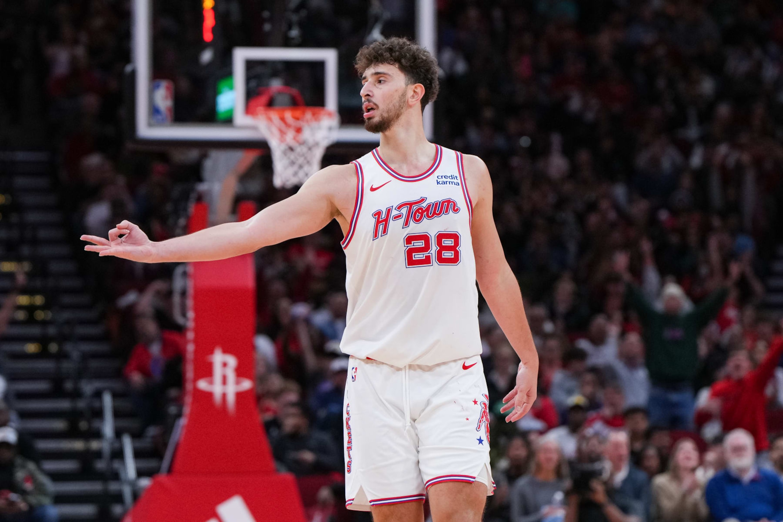 HOUSTON, TEXAS - DECEMBER 27: Alperen Sengun #28 of the Houston Rockets reacts after sinking a three point shot in the fourth quarter of the game against the Phoenix Suns at Toyota Center on December 27, 2023 in Houston, Texas. User expressly acknowledges and agrees that, by downloading and or using this photograph, User is consenting to the terms and conditions of the Getty Images License Agreement. (Photo by Alex Bierens de Haan/Getty Images)