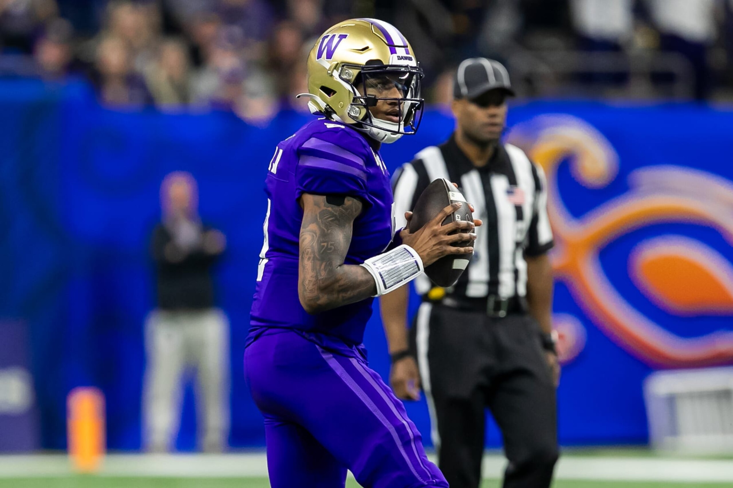 NEW ORLEANS, LA - JANUARY 01: Washington quarterback Michael Penix Jr. (9) searches for an open receiver during the Allstate Sugar Bowl playoff game between the Texas Longhorns and the Washington Huskies on Monday, January 1, 2024 at Caesars Superdome in New Orleans, LA. (Photo by Nick Tre. Smith/Icon Sportswire via Getty Images) NEW ORLEANS, LA - JANUARY 01: Washington quarterback Michael Penix Jr. (9) searches for an open receiver during the Allstate Sugar Bowl playoff game between the Texas Longhorns and the Washington Huskies on Monday, January 1, 2024 at Caesars Superdome in New Orleans, LA. (Photo by Nick Tre. Smith/Icon Sportswire via Getty Images)